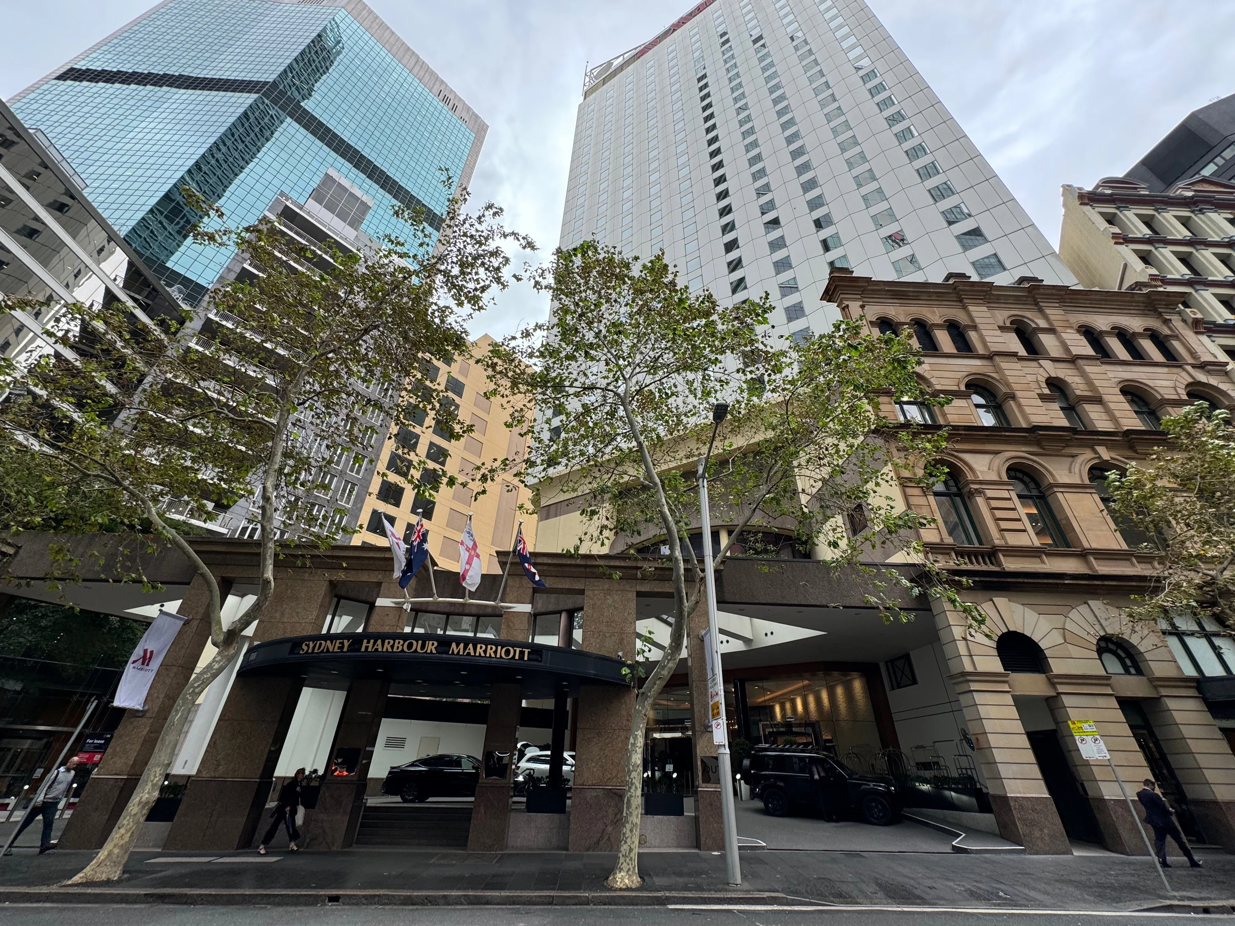 The high-rise hotel and the street at its entrance.