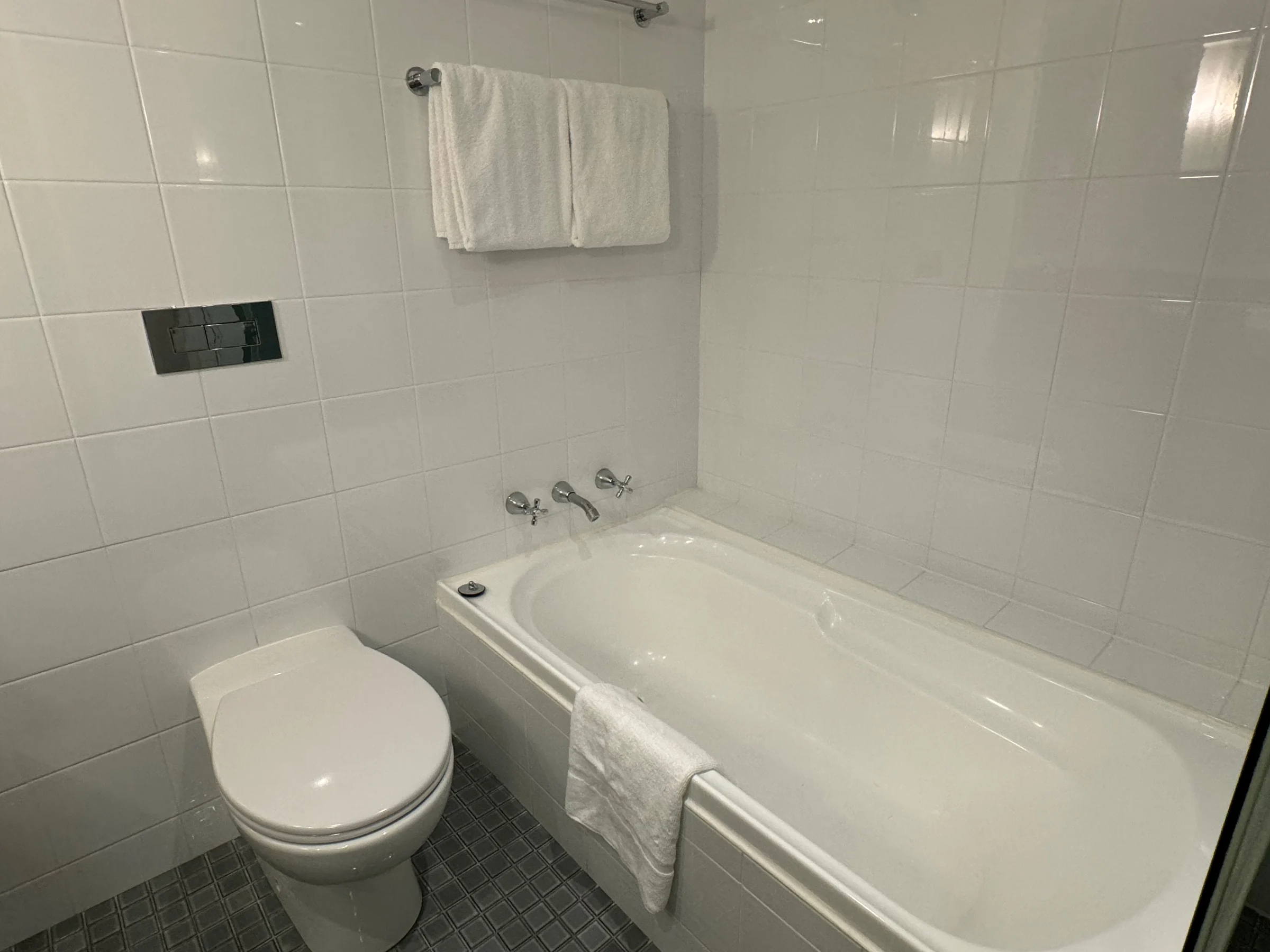 The bathroom, with a bathtub and shower.