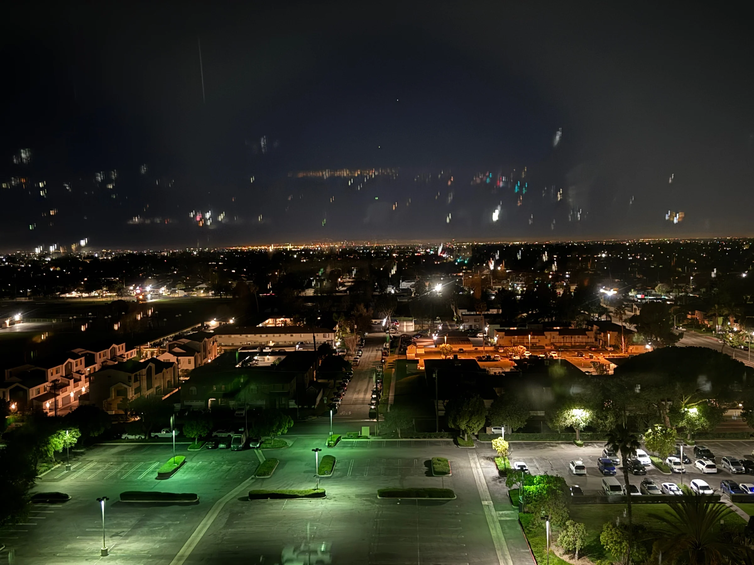 The city outside, still dark.