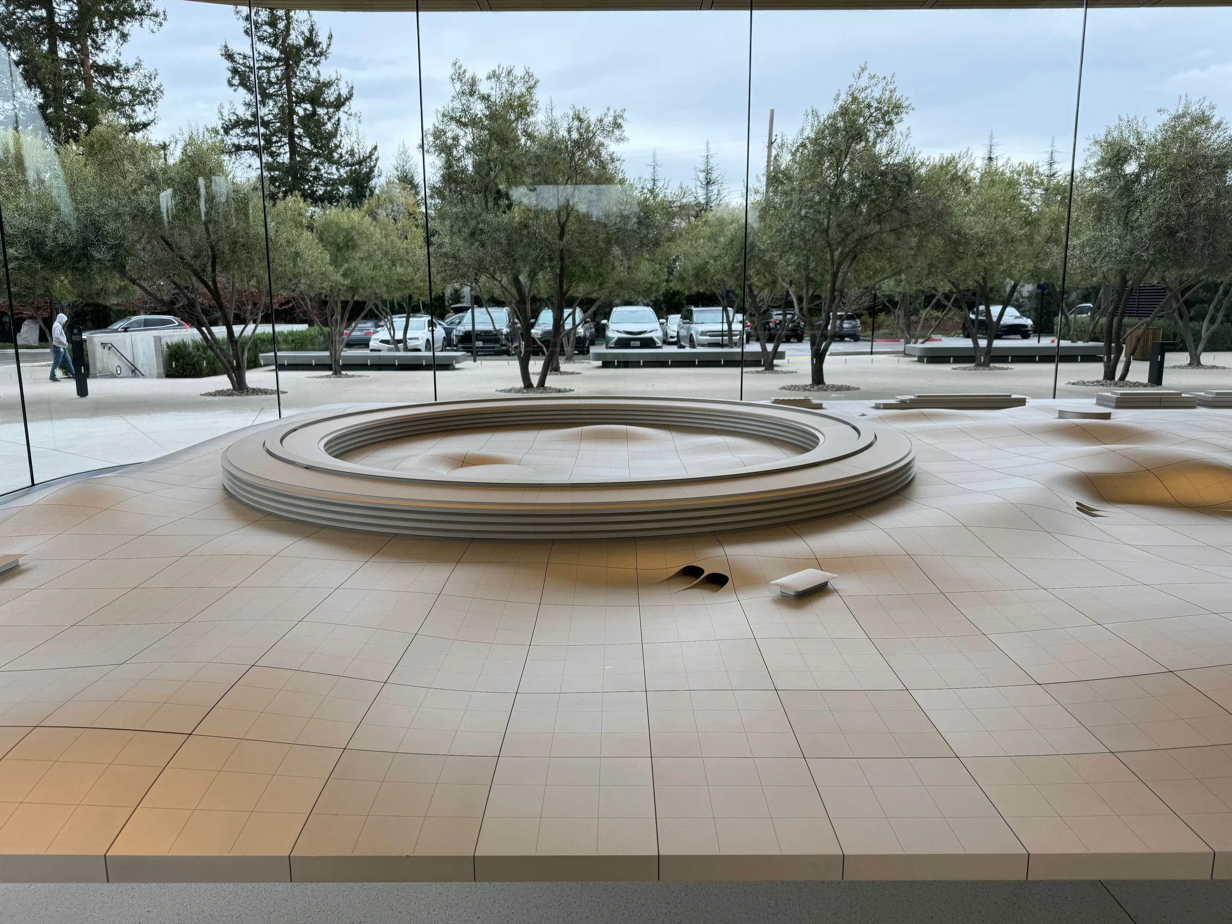 A model of Apple Park beyond the large windows.