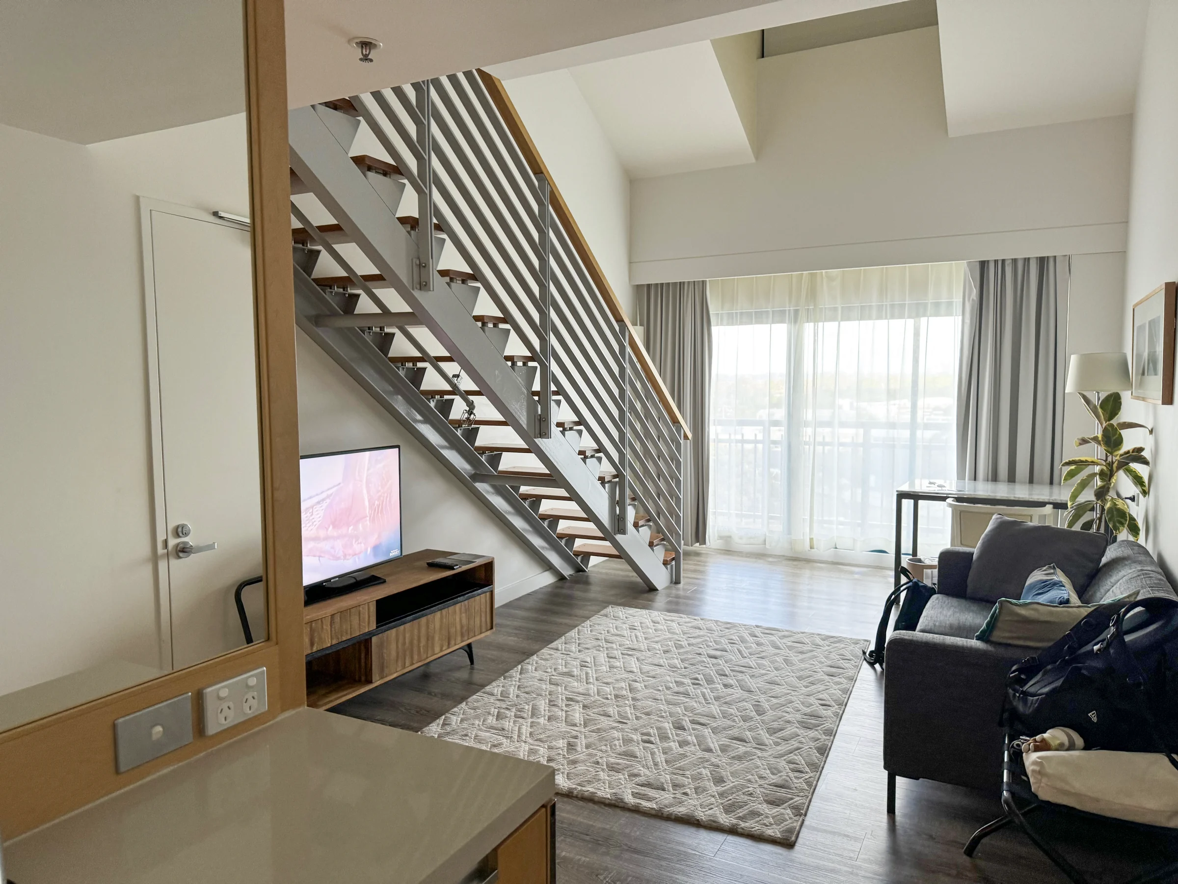 The Loft Suite with stairs at Courtyard Sydney–North Ryde