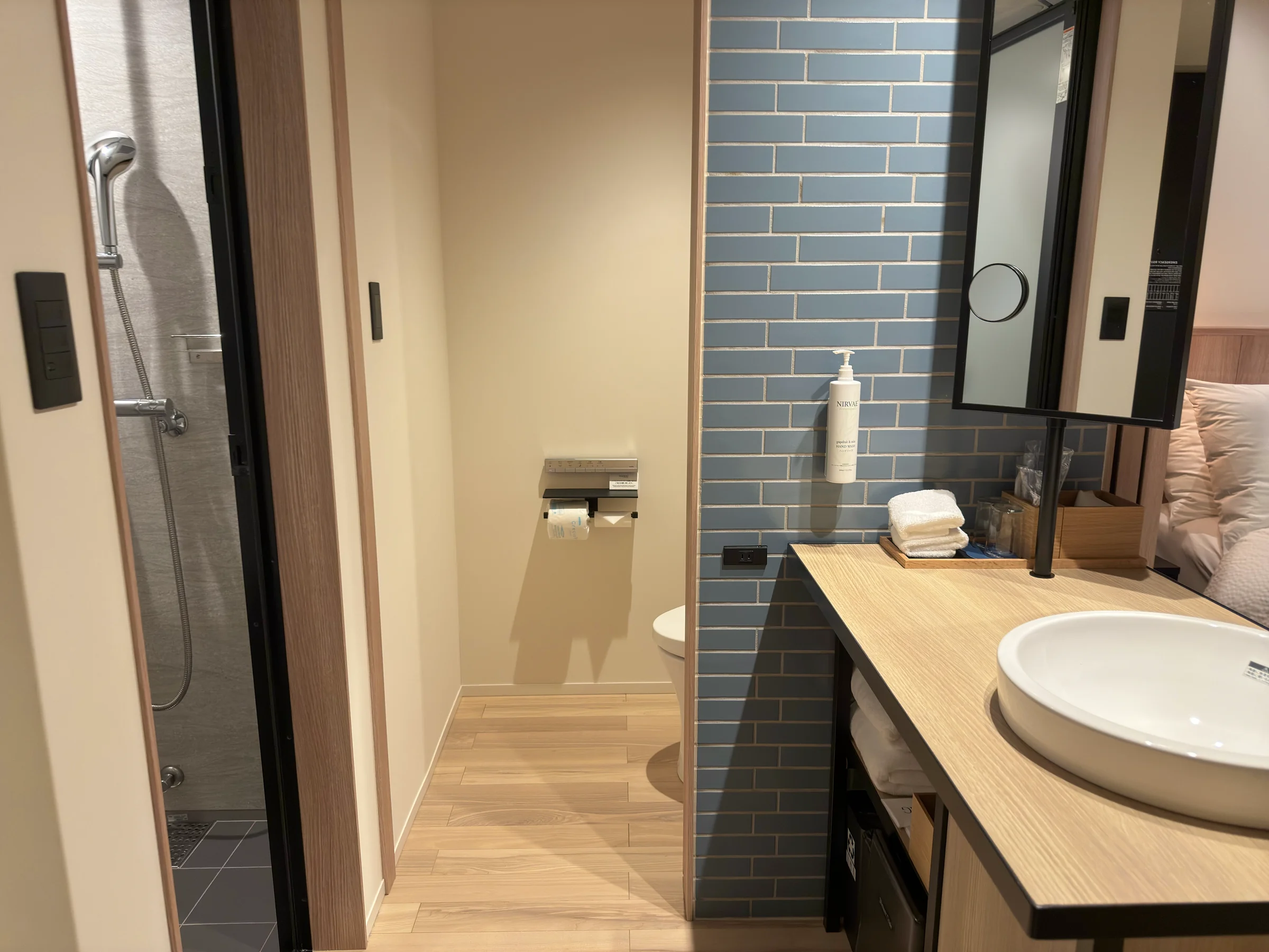 The blue-tiled vanity area