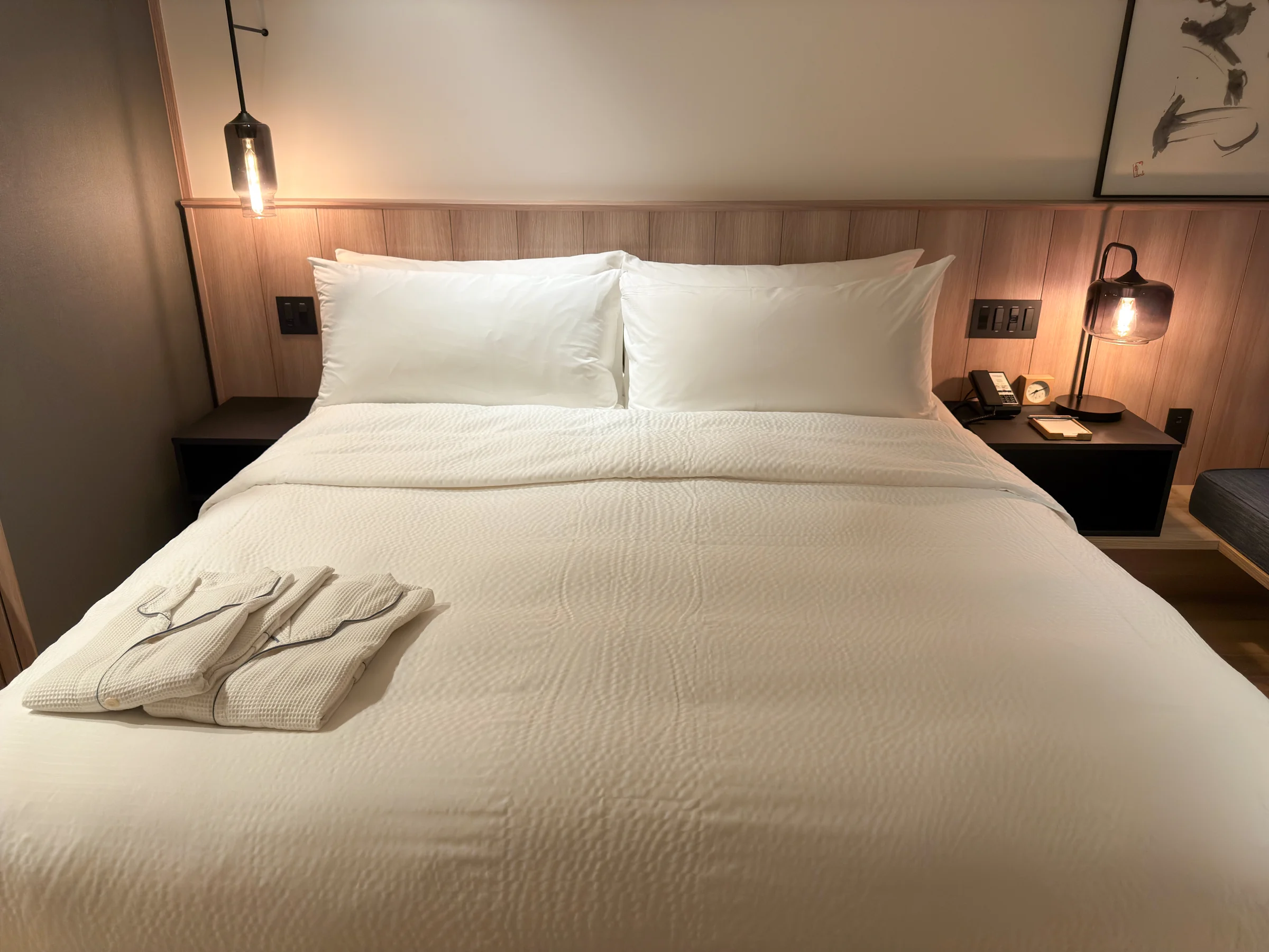 The king bed and bedside lighting