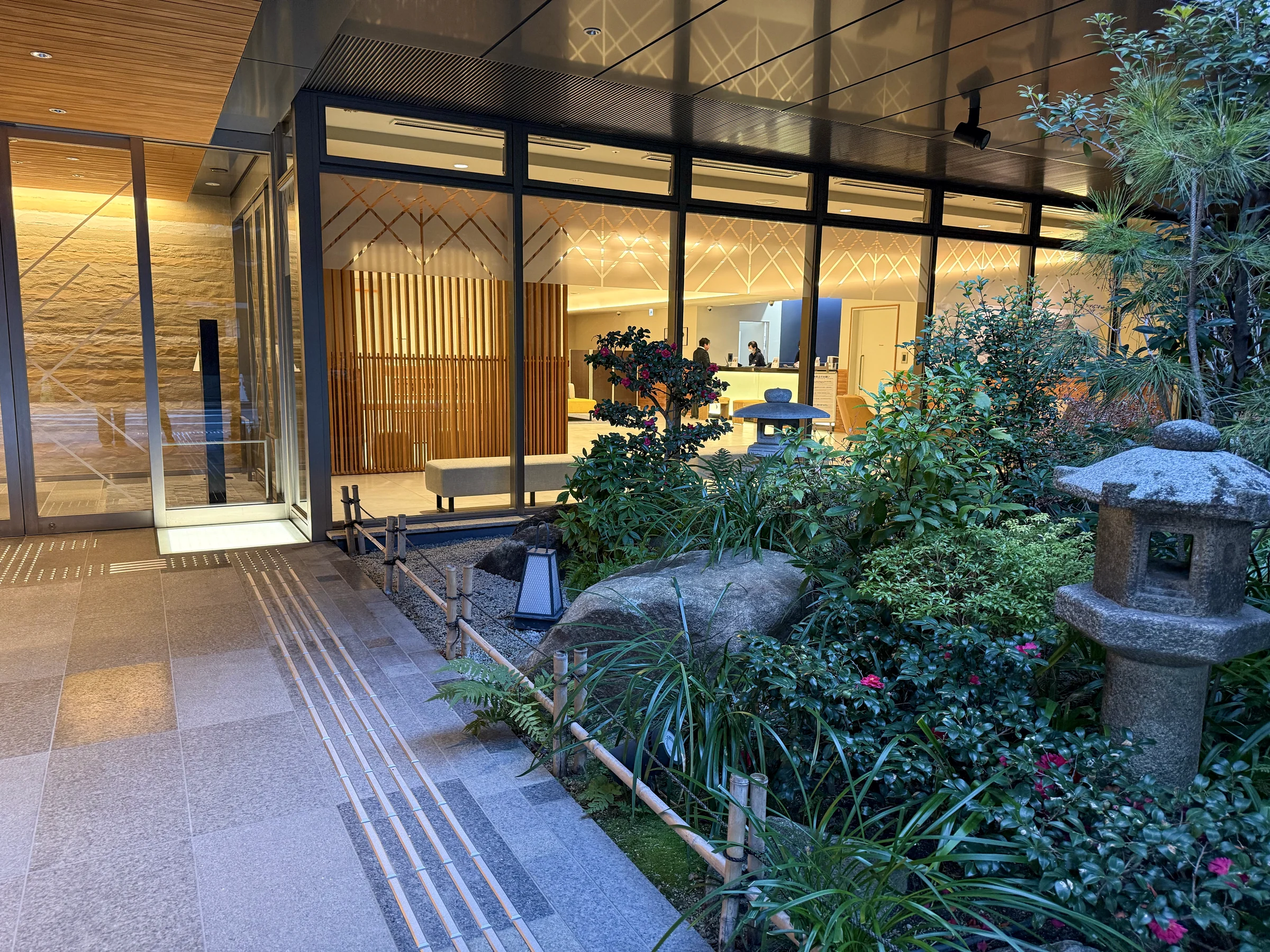 The garden in the evening and lights in the lobby.