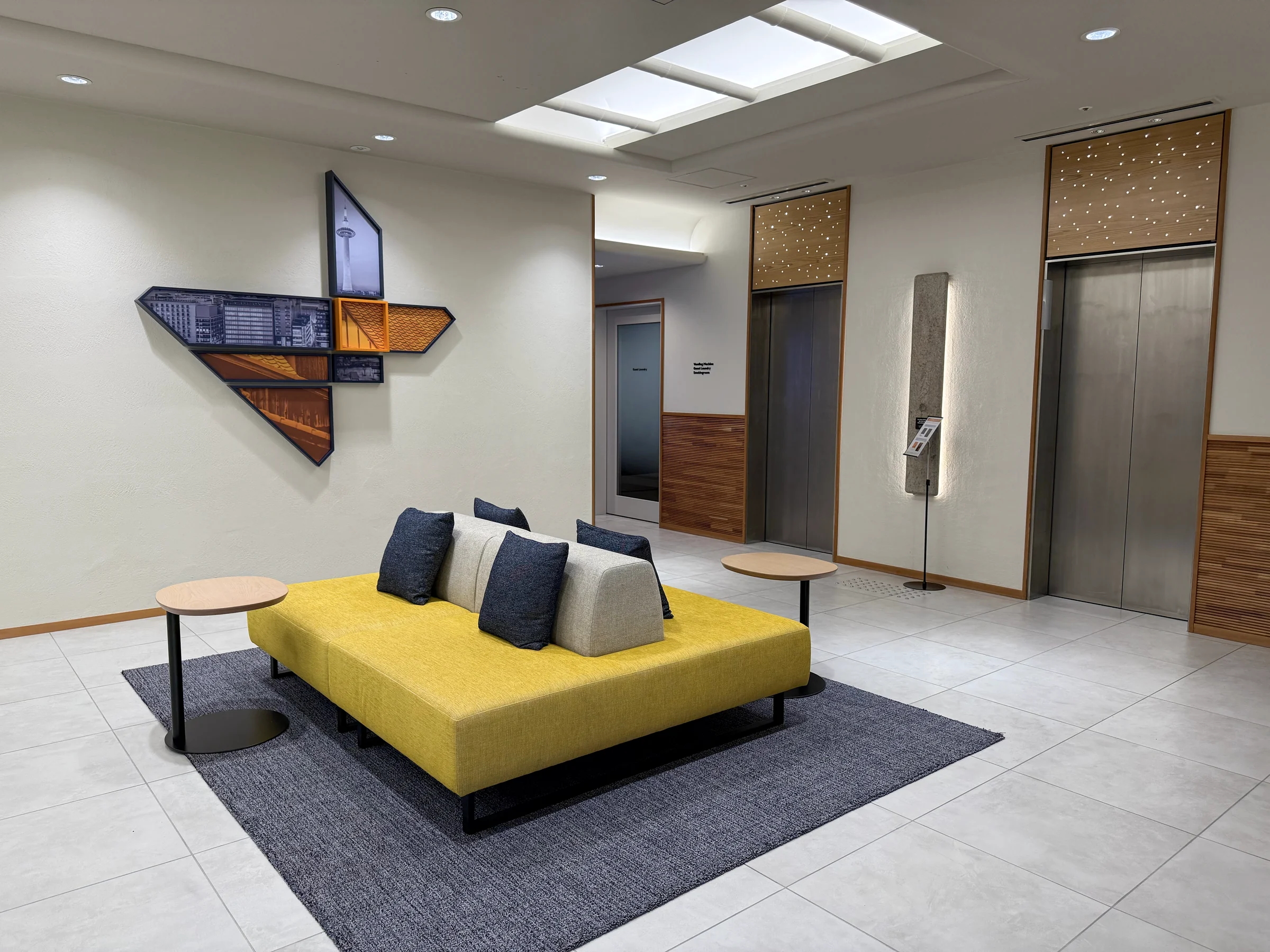 Yellow sofas in the lobby seating area.