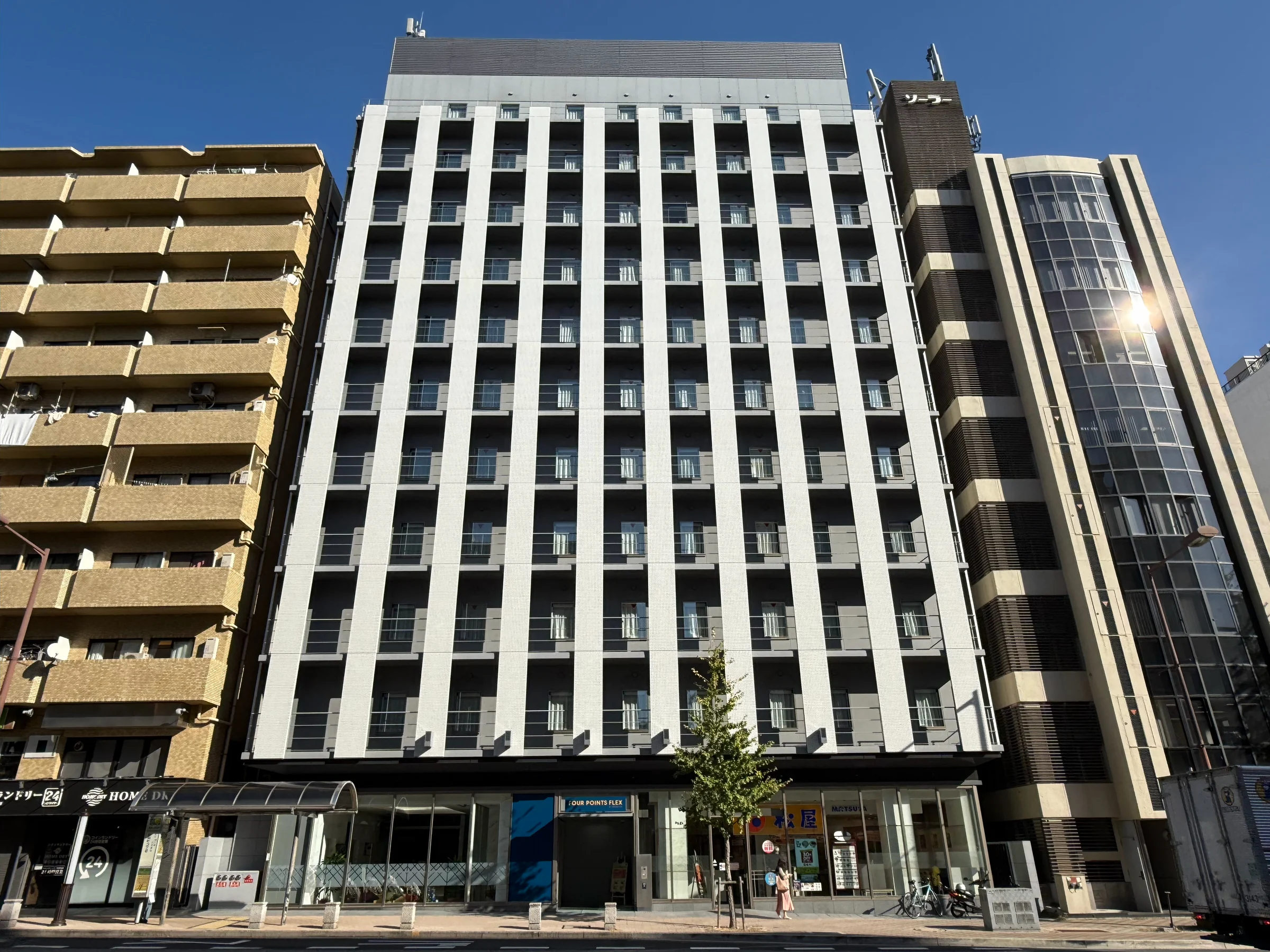 The hotel exterior with its blue sign