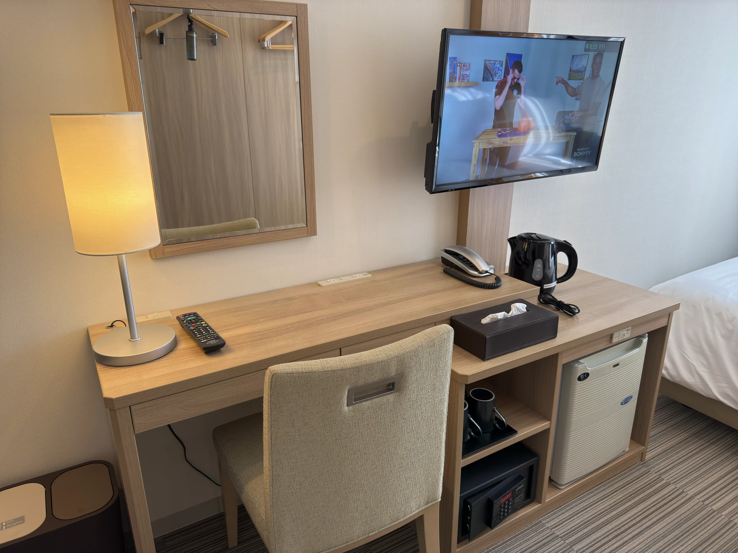 The desk and TV in the room