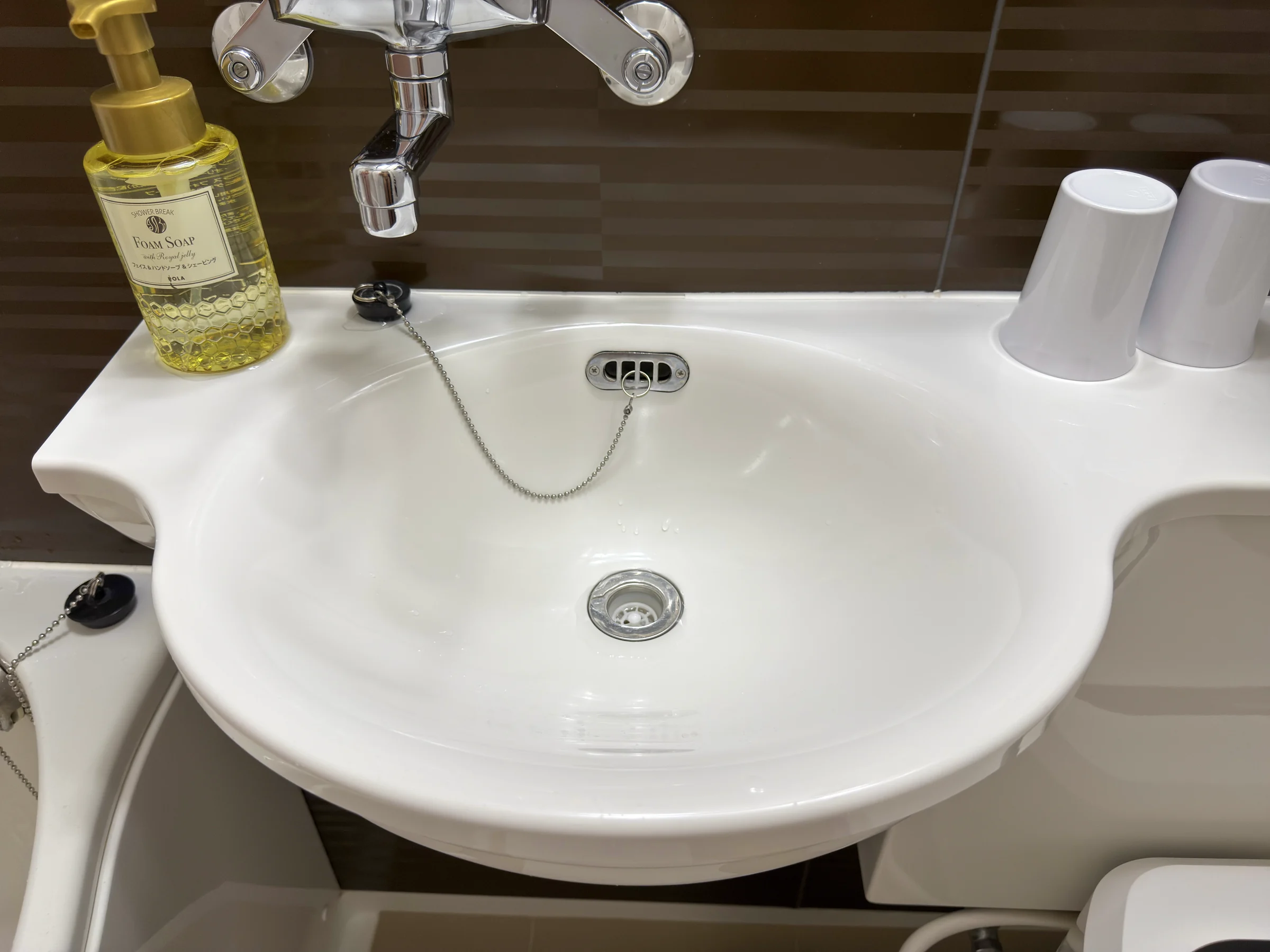 The washbasin with hand soap and cups