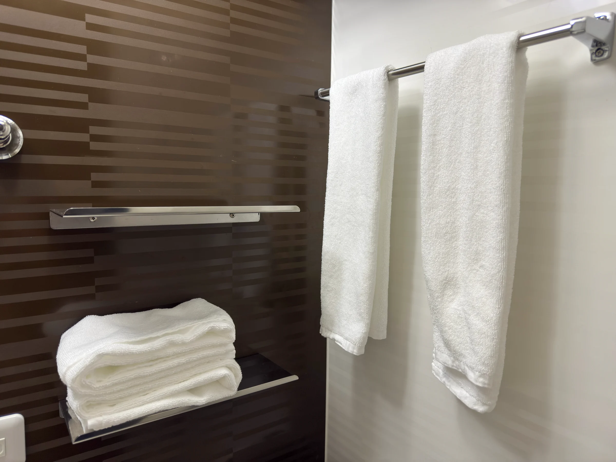 The towel rack and spare towels