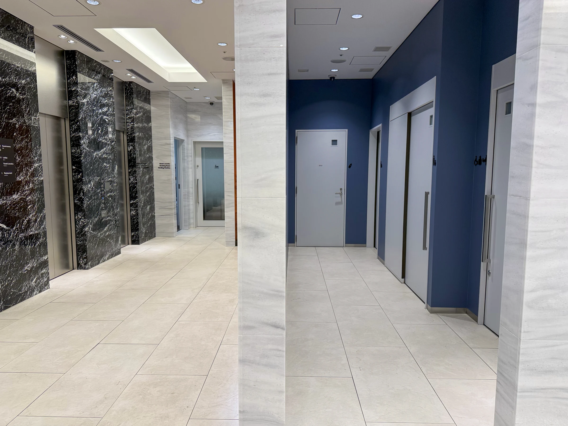 The marble-effect elevator lobby.