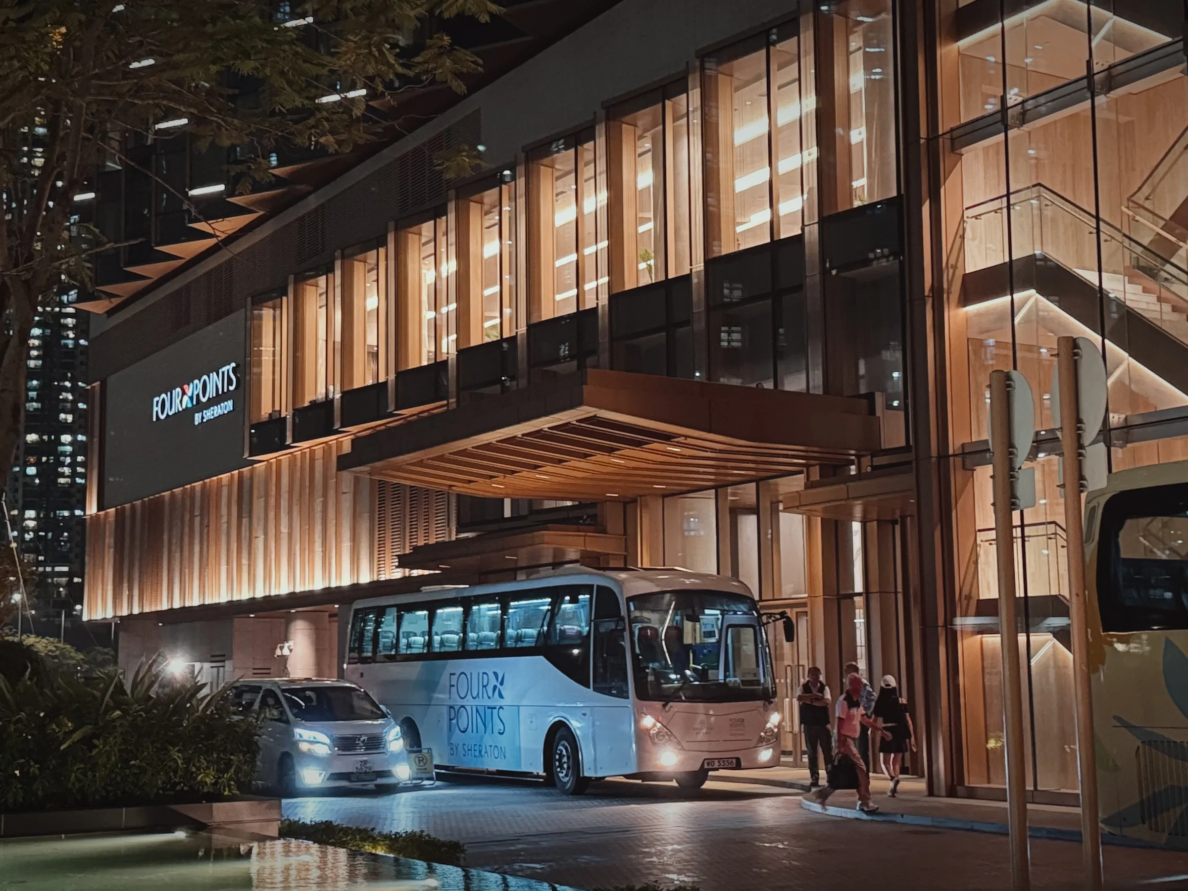 The entrance at night, where the shuttle bus stops