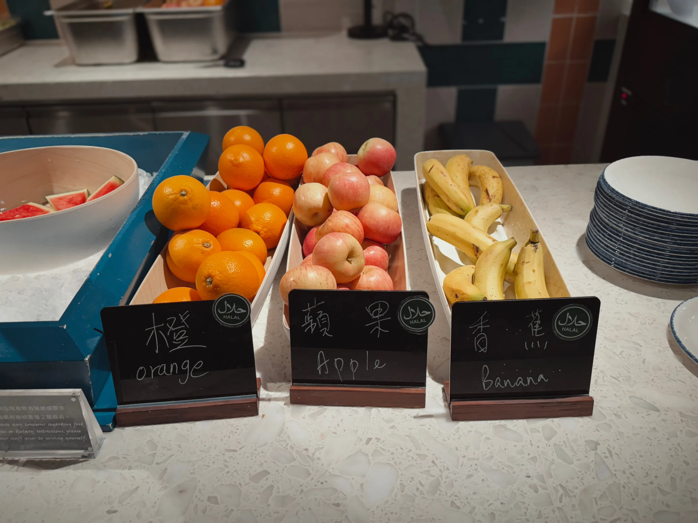Oranges, apples and bananas at the fruit station