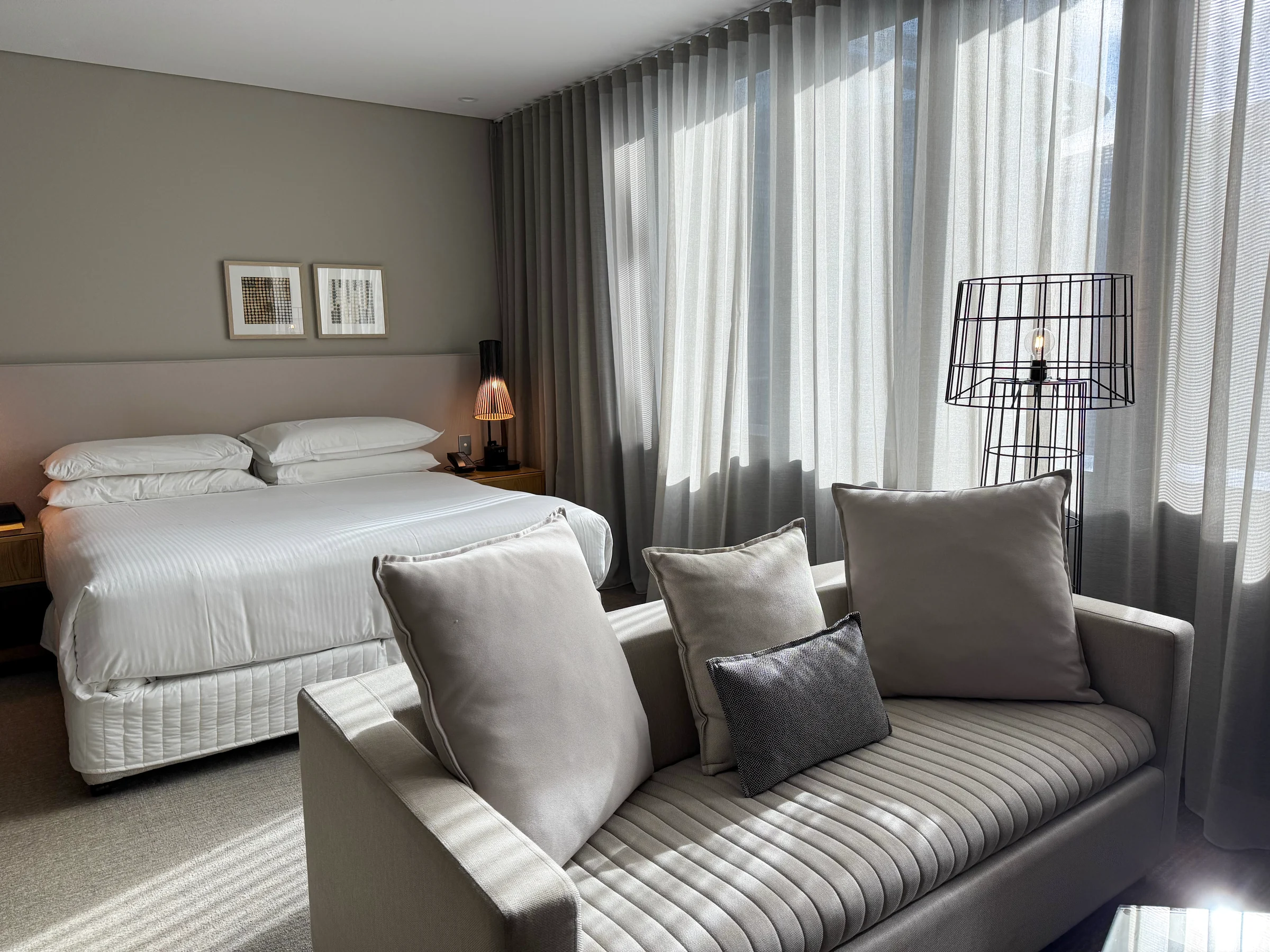 The Studio at Four Points by Sheraton Sydney, with a king bed and window-side sofa