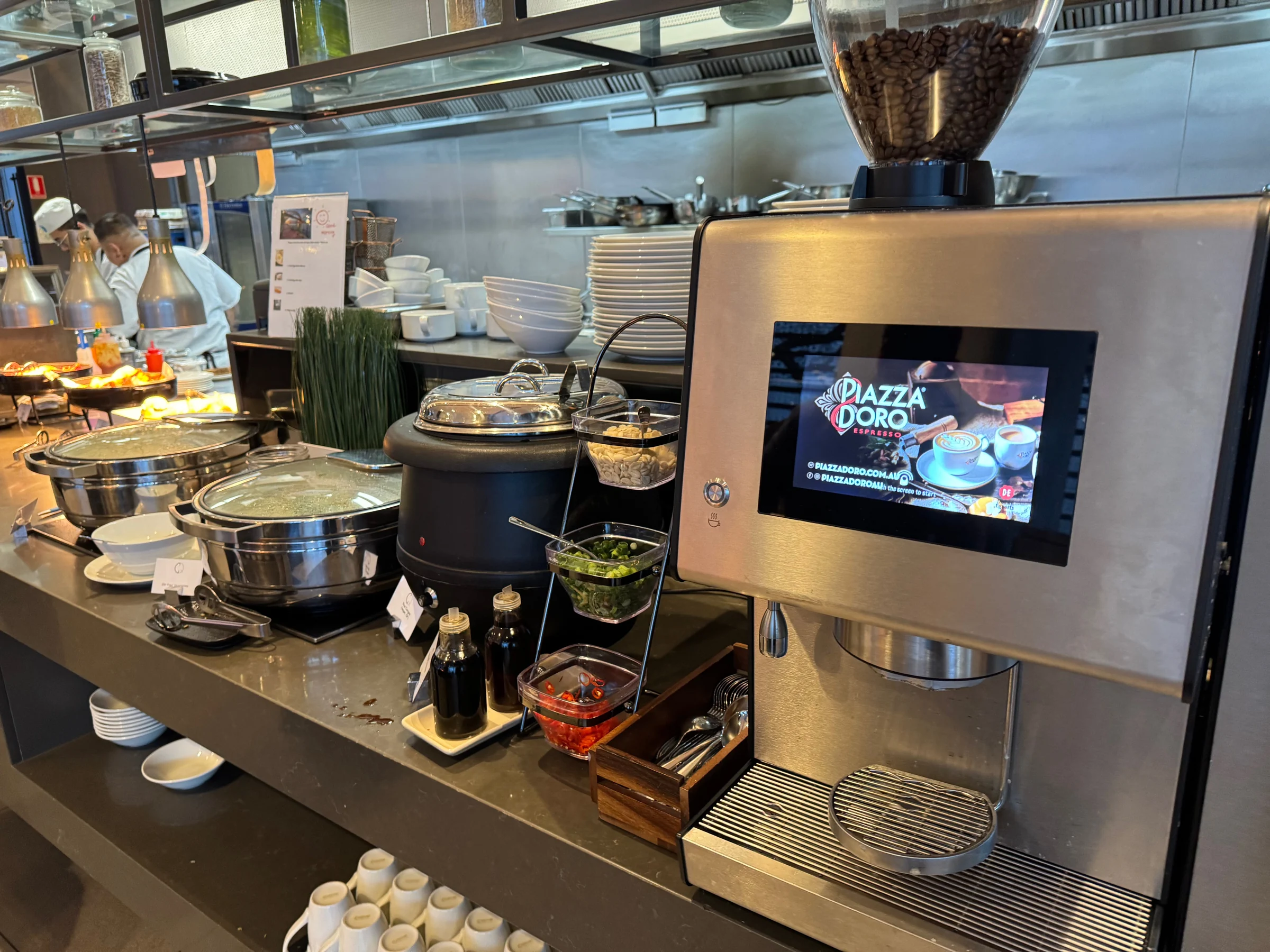 The coffee machine and cups.