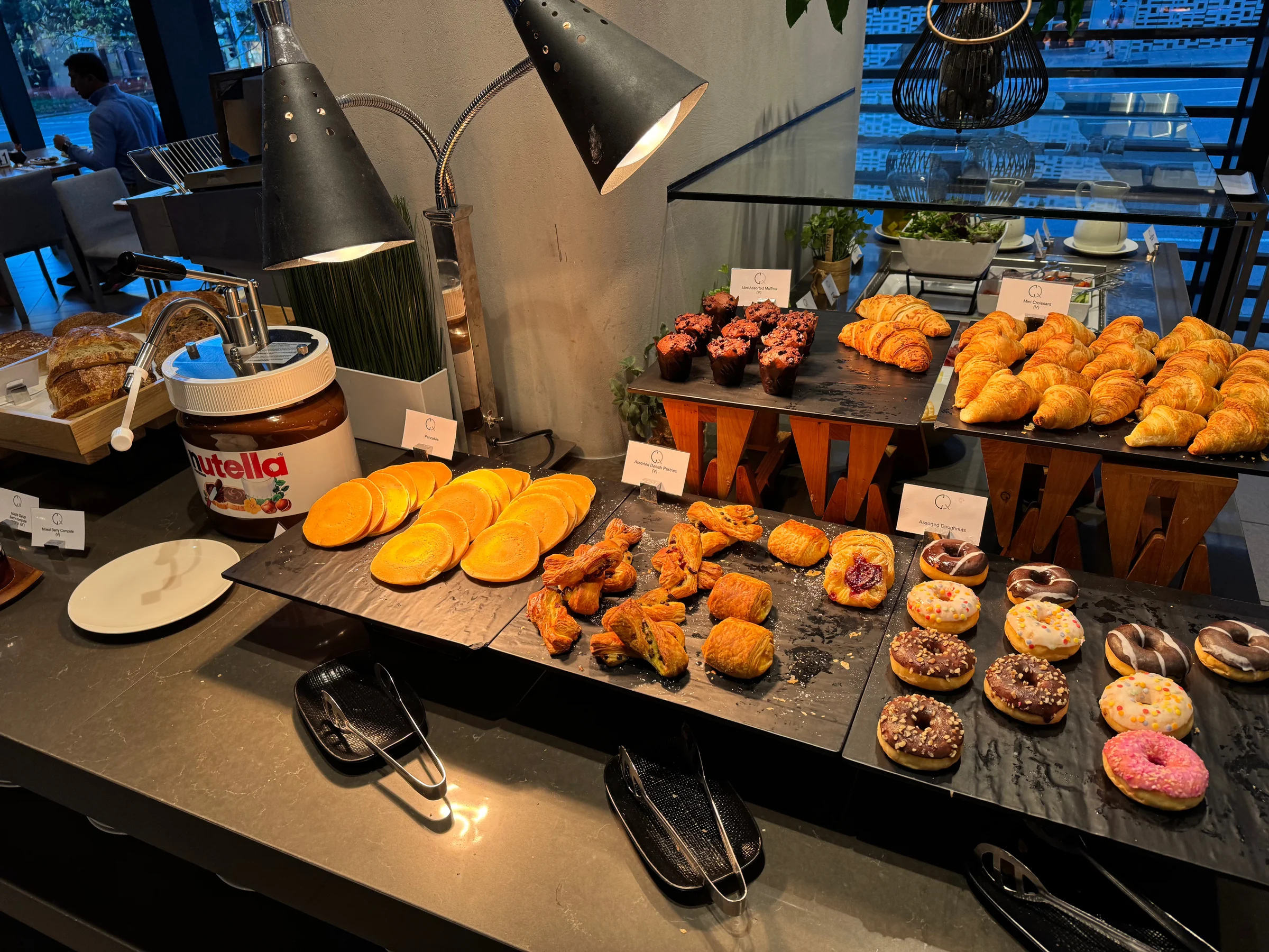 Pastries and doughnuts on the counter.