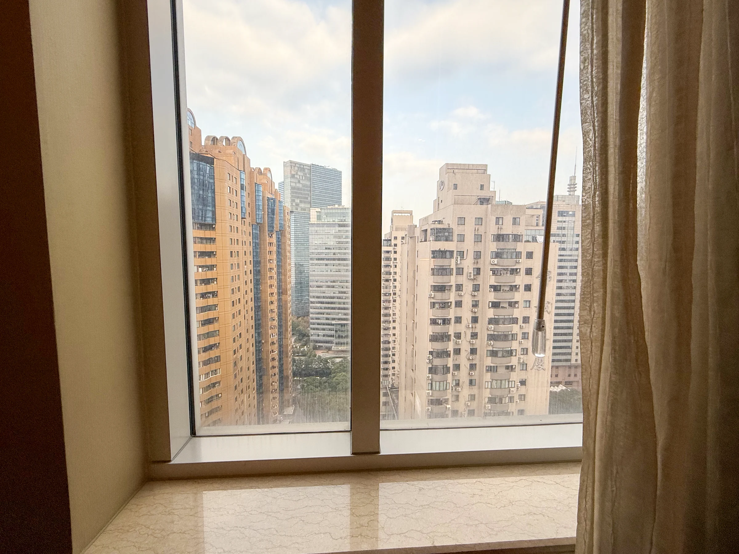 Shanghai's skyscrapers from the room.