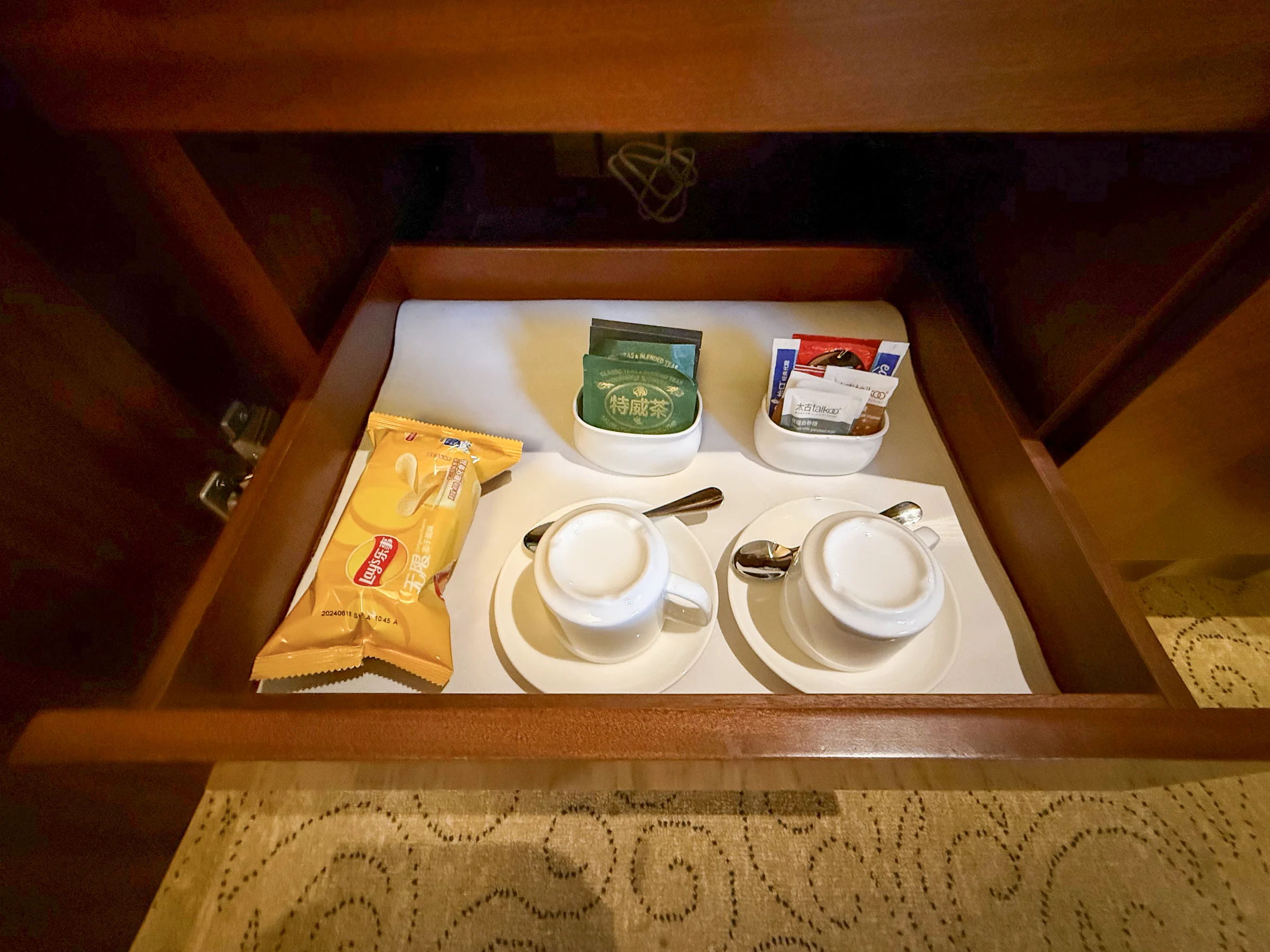 Tea supplies stored in a drawer.