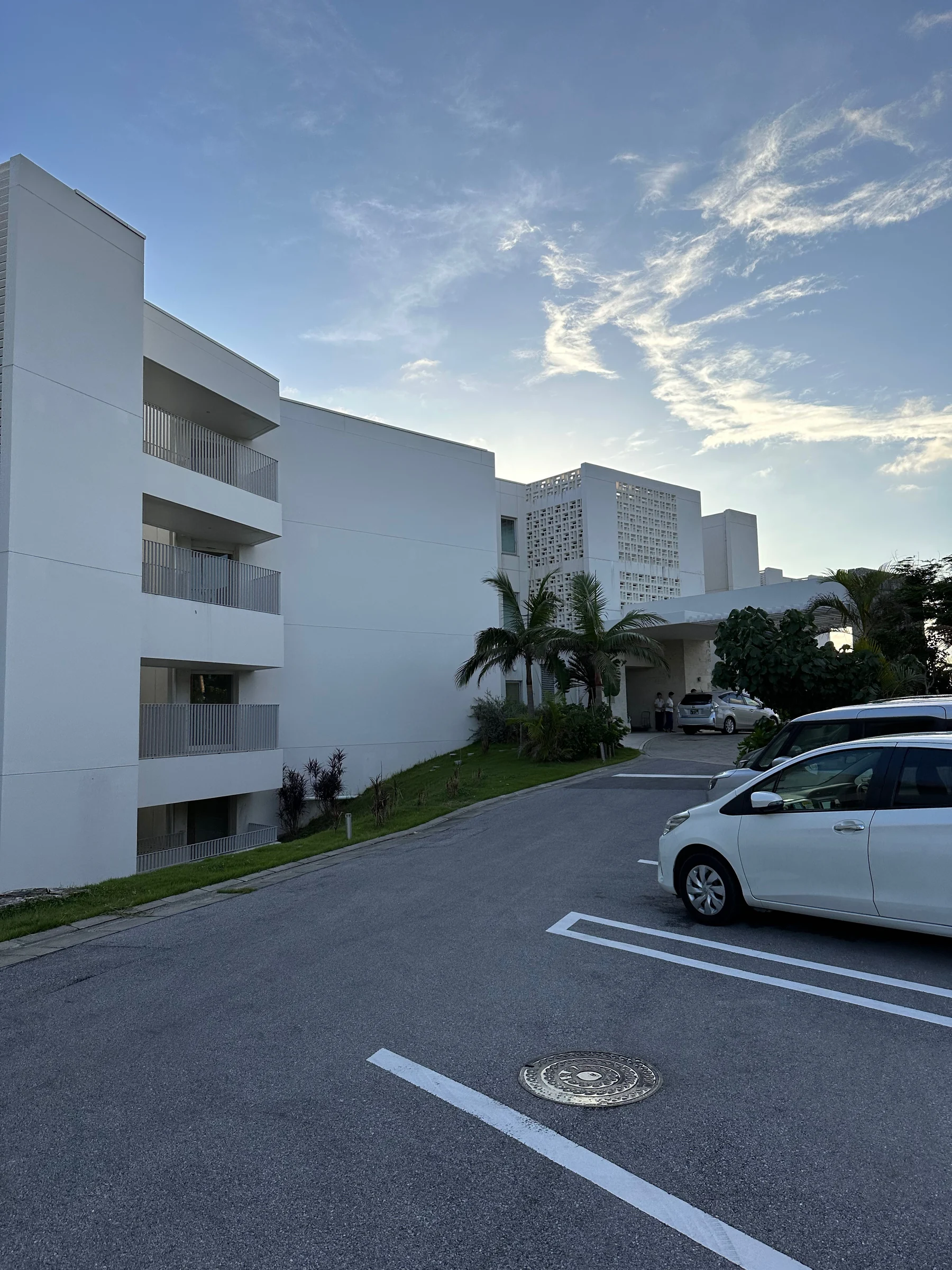 The white hotel beneath a blue sky.