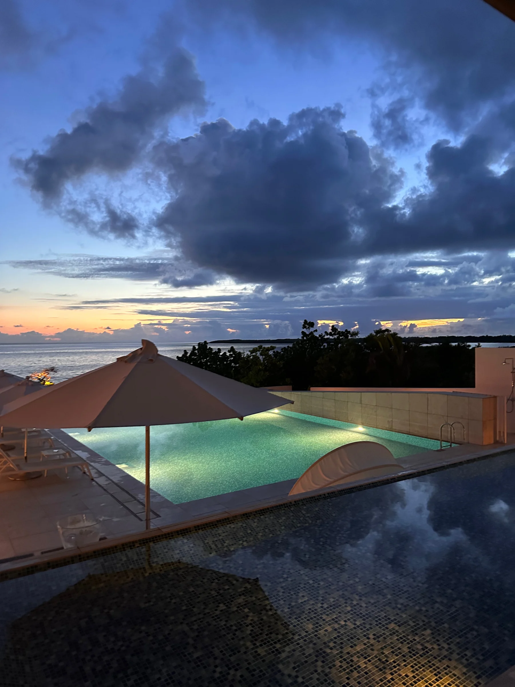 The dusk sky reflected in the pool.