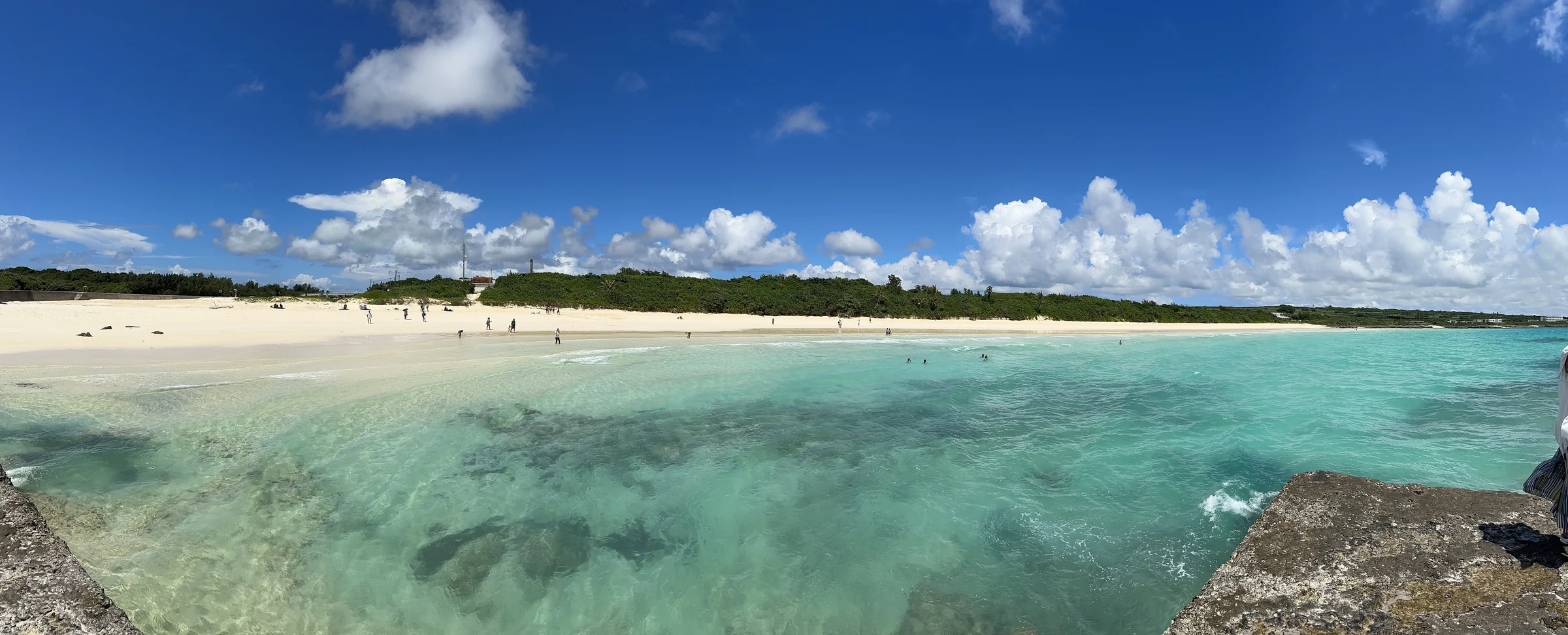 Clear shallows and a white sandy beach.