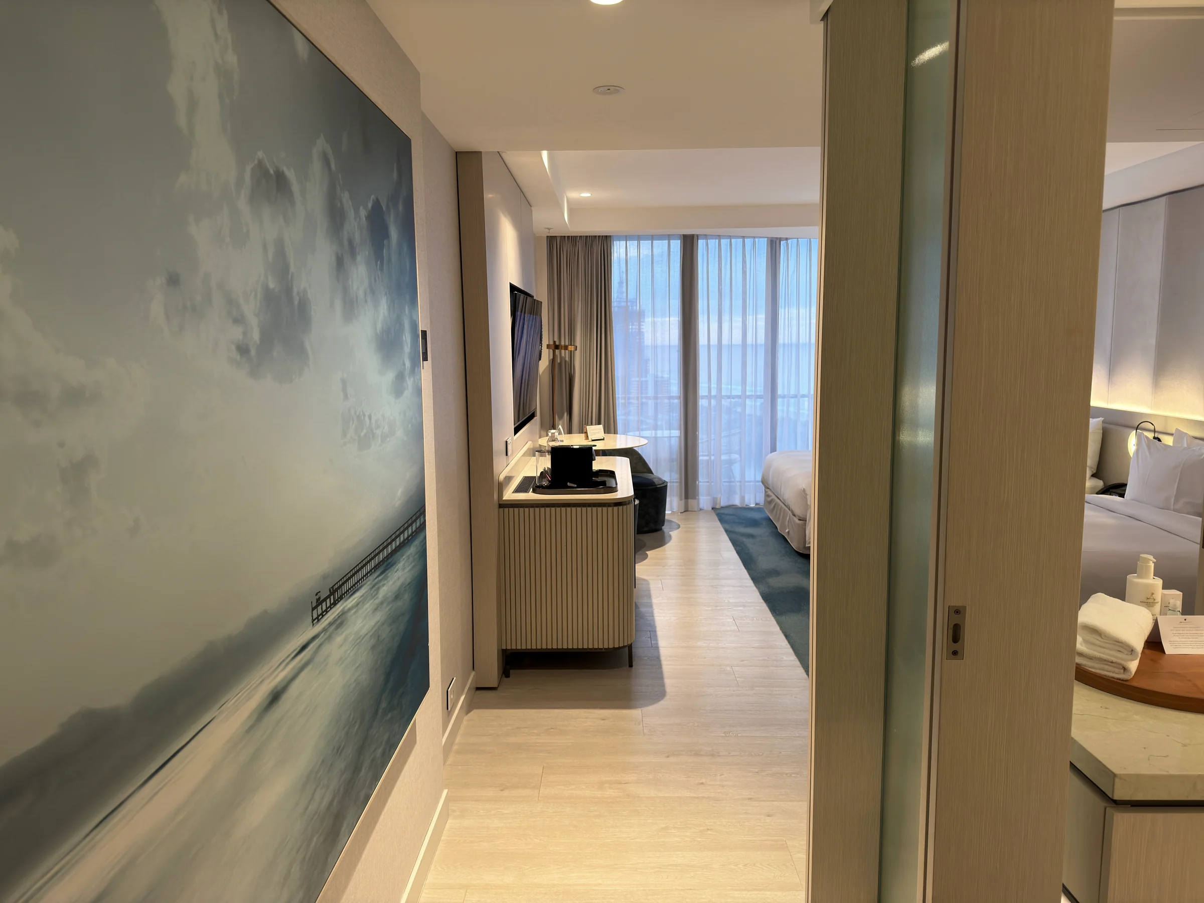 The large ocean artwork at the room entrance.