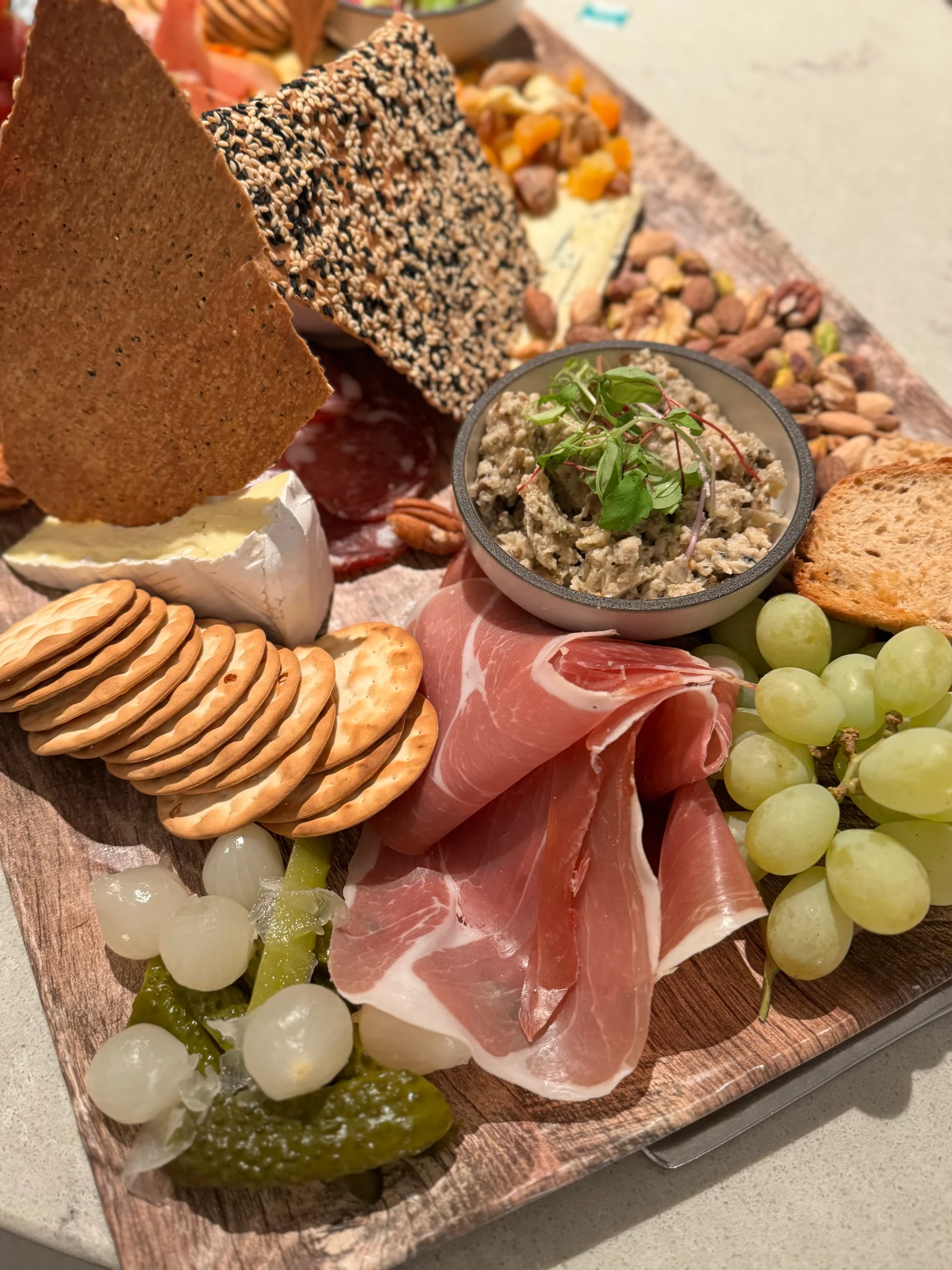 The cheese and ham platter ordered in the room.