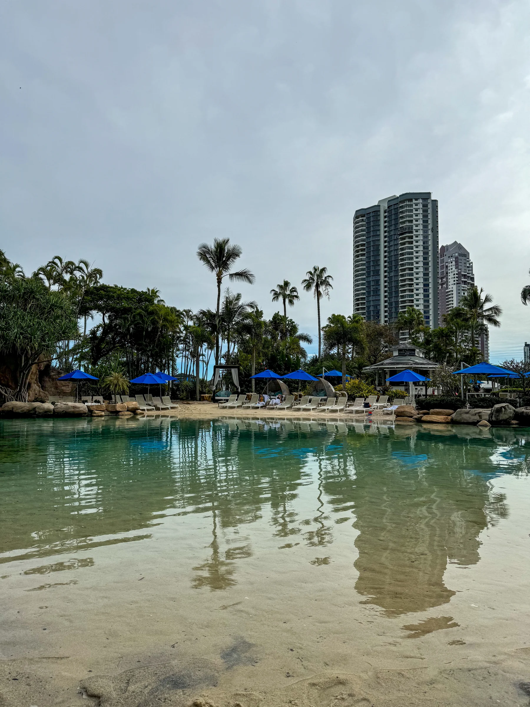 A sandy poolside.