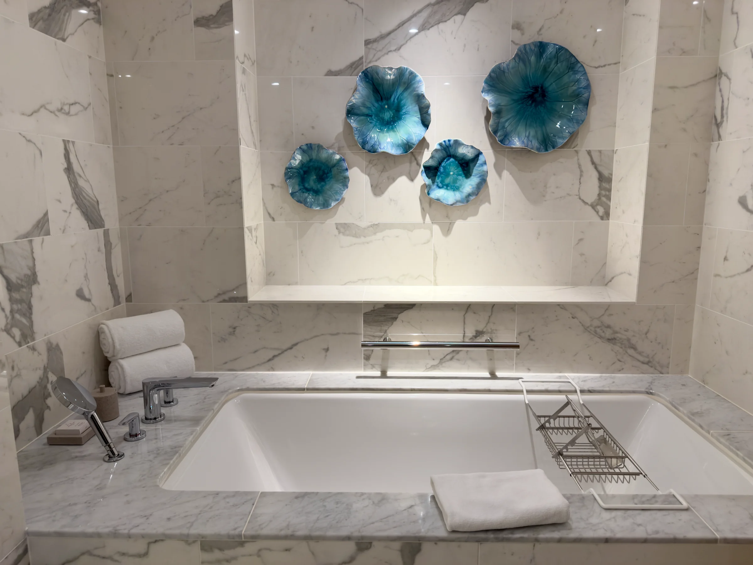 The bathtub with floral artwork.