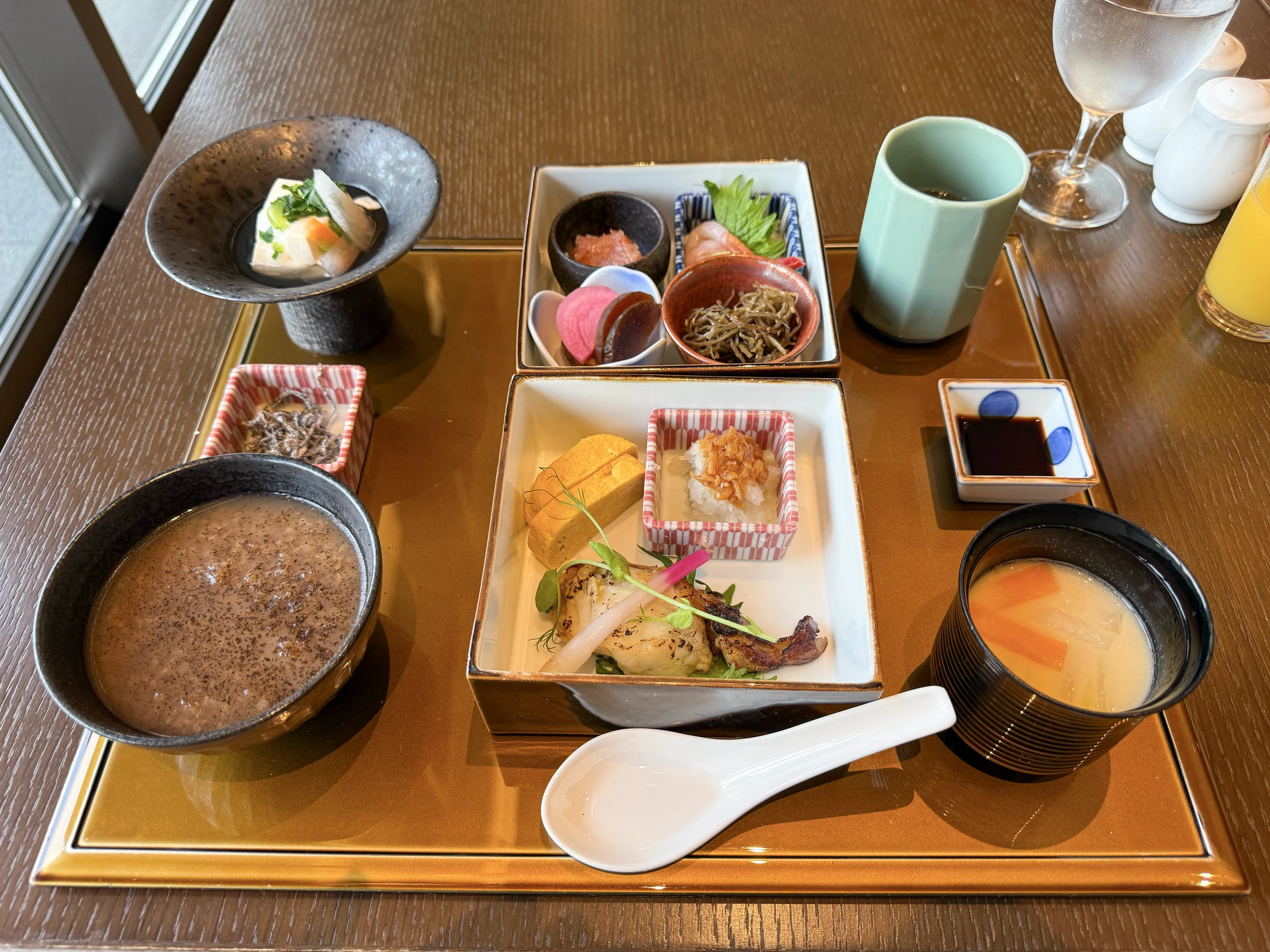 Japanese breakfast with rice porridge and Asuka soup.