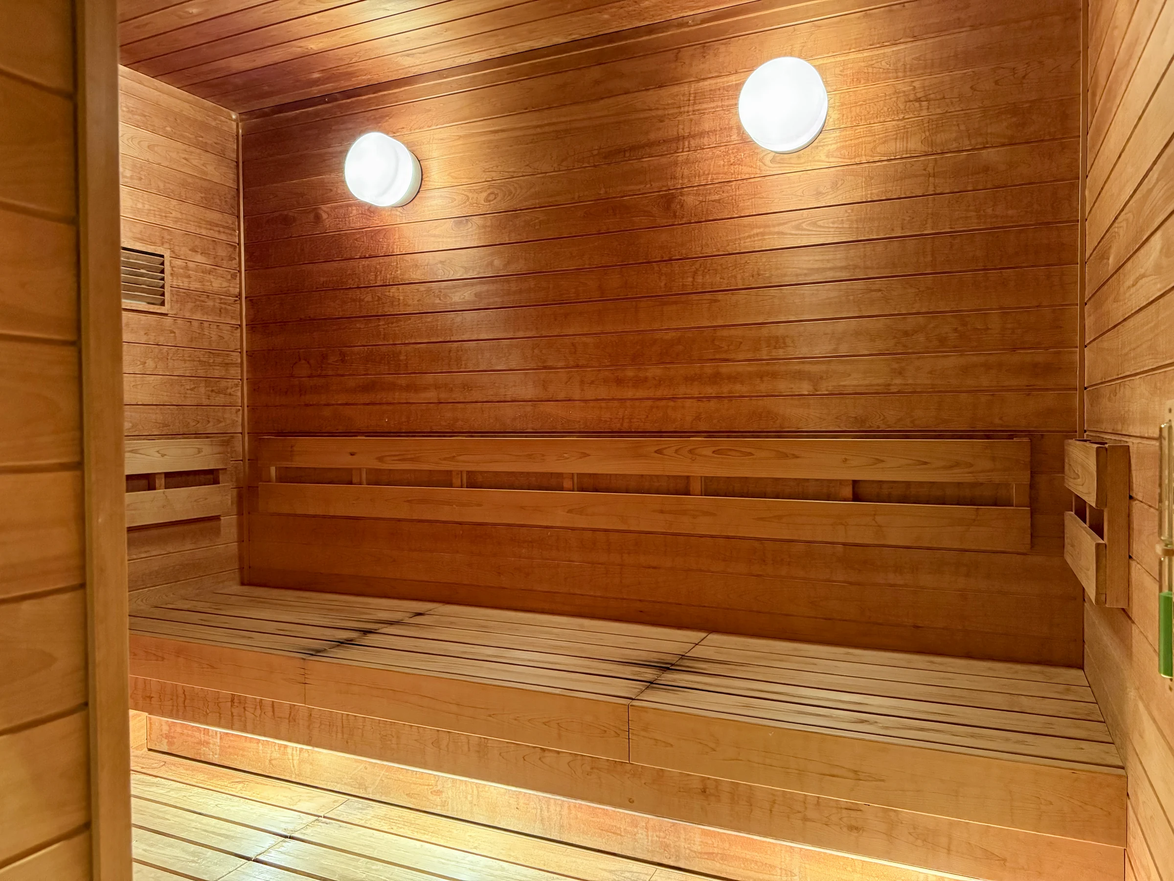 A sauna with warm wood tones.