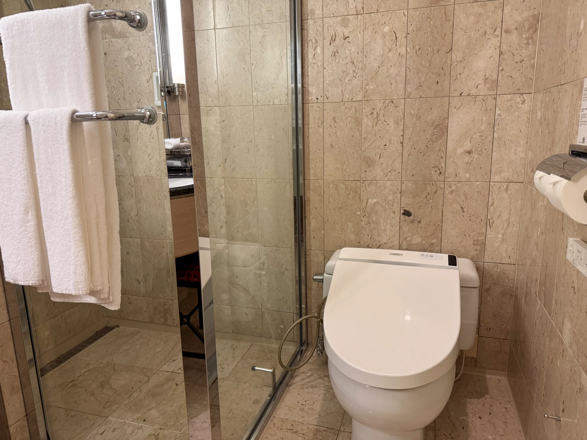 The shower cubicle and toilet.