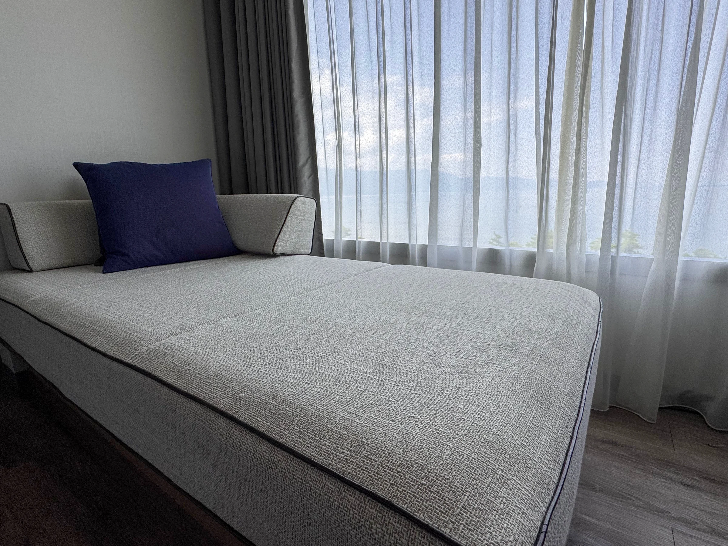 A comfortable sofa by the window