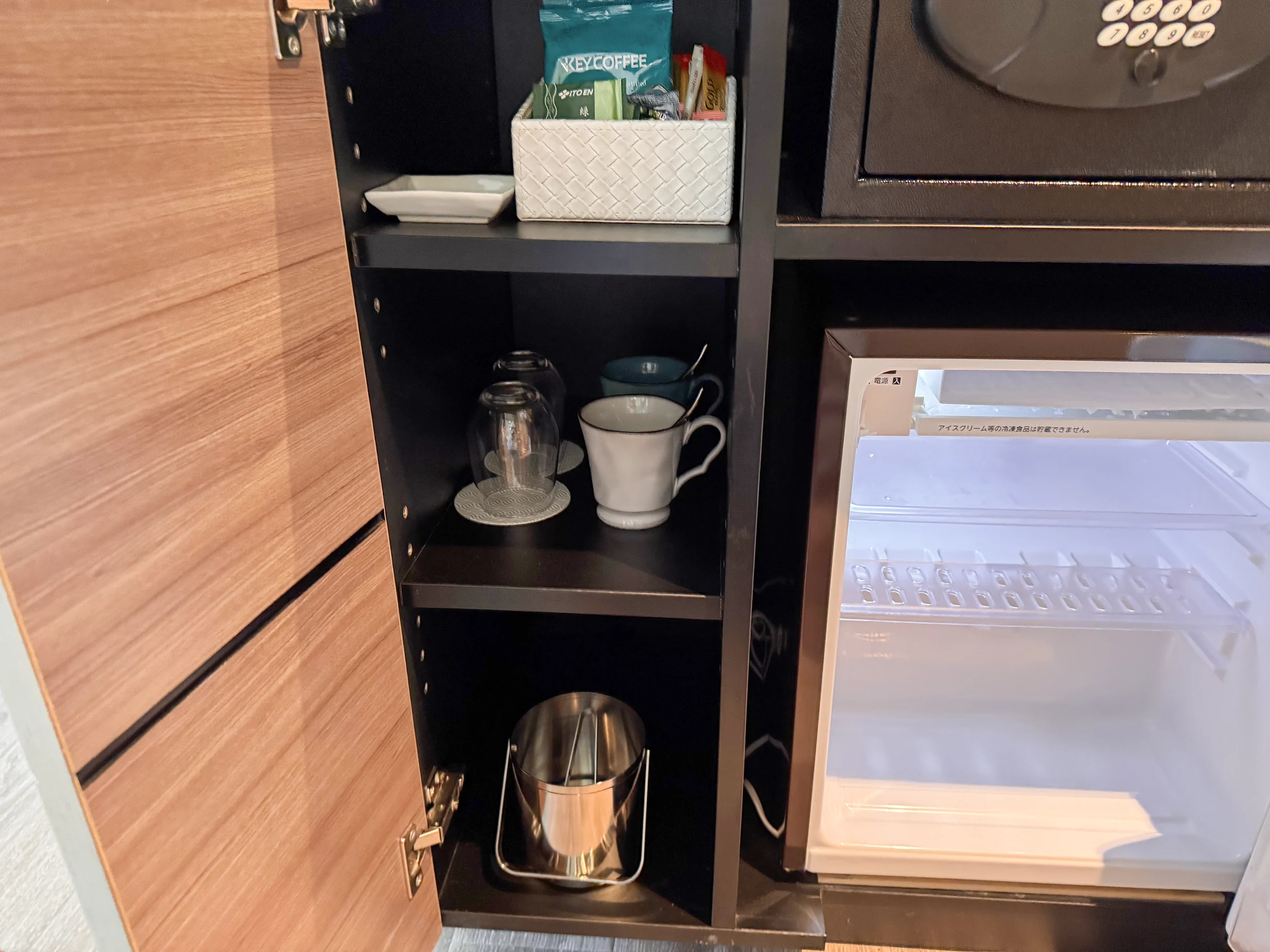 Cups, tea supplies and an empty fridge