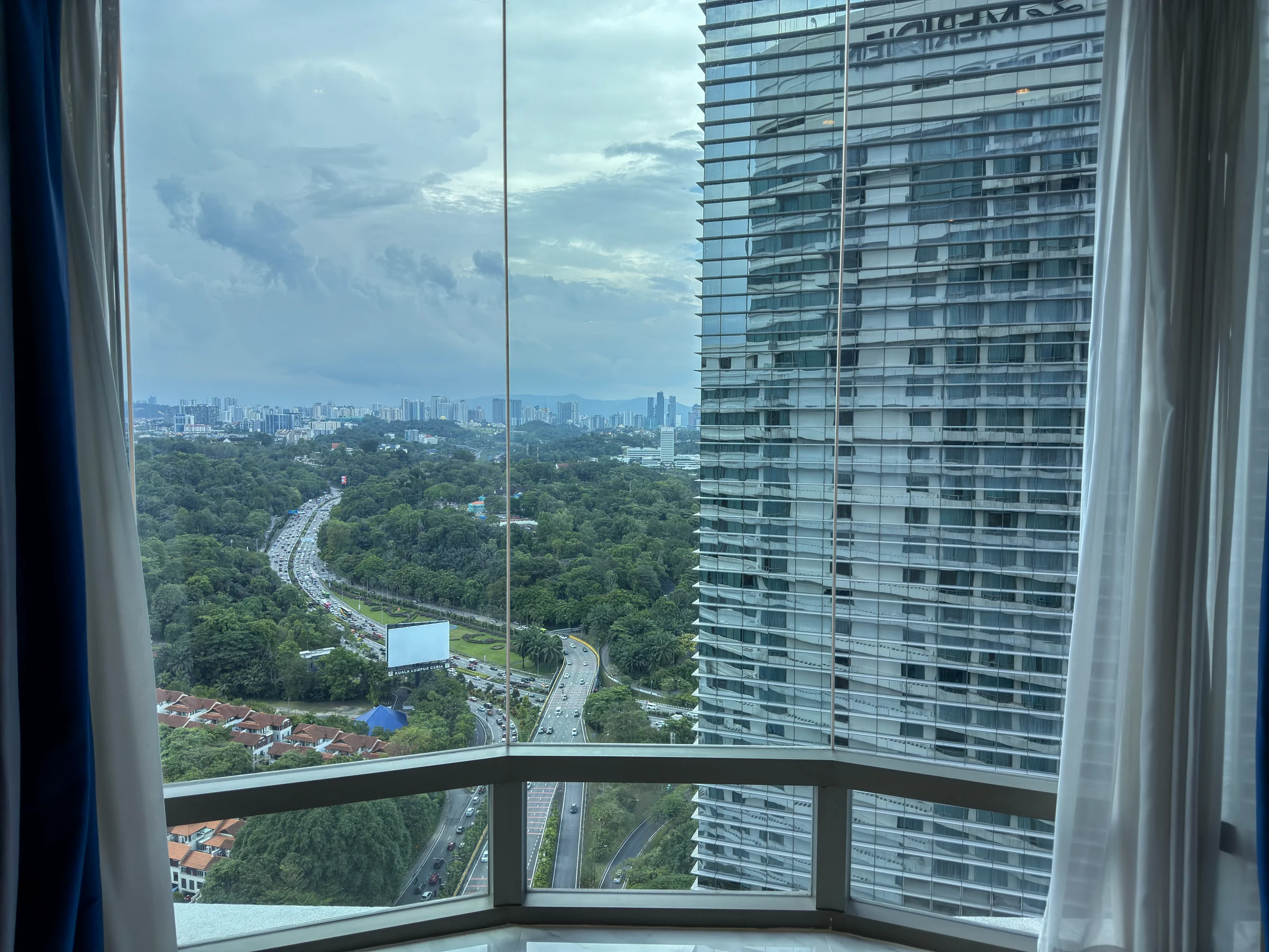City roads and buildings beyond the windows.