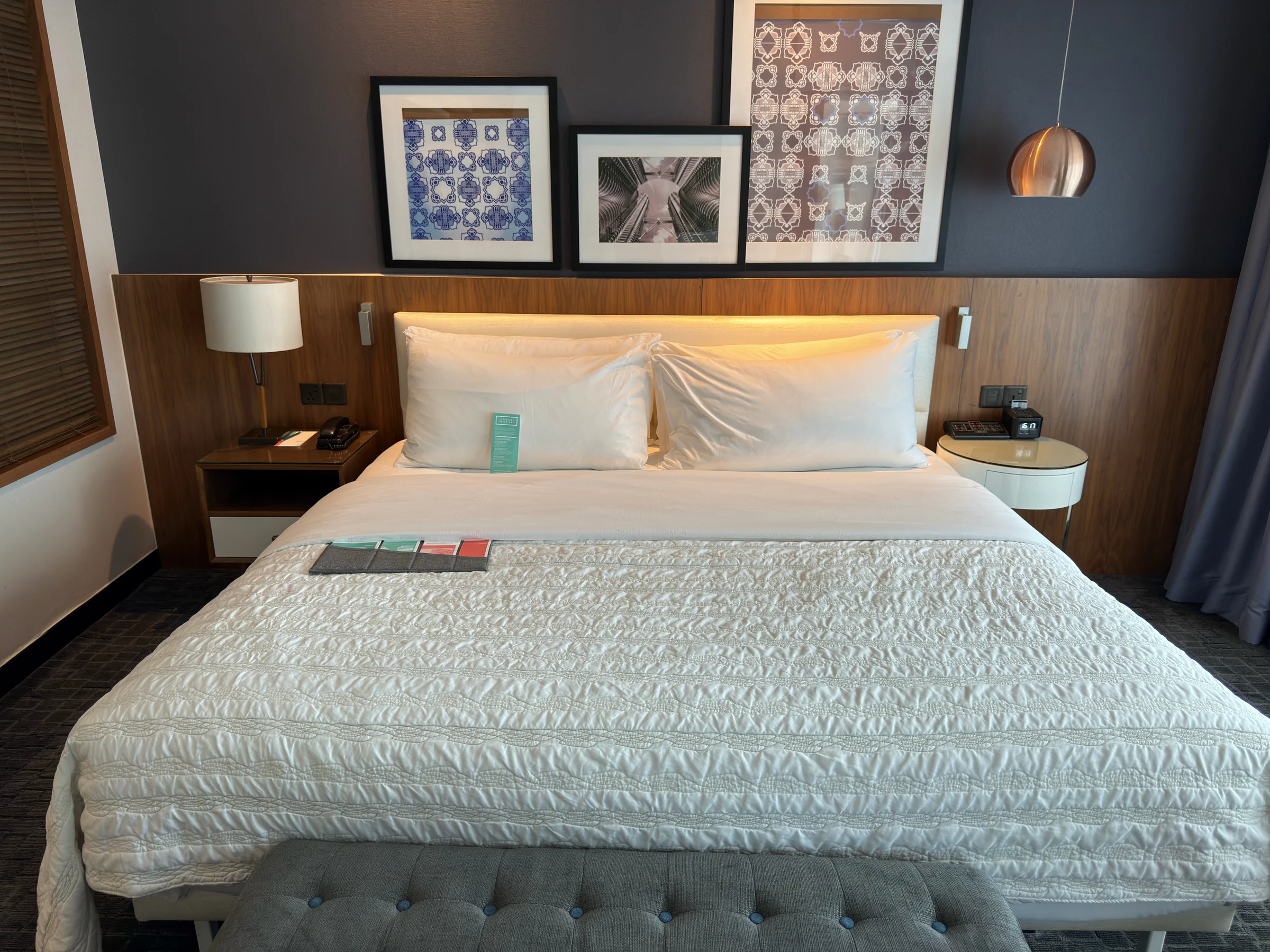 The king bed and window-side sofa.