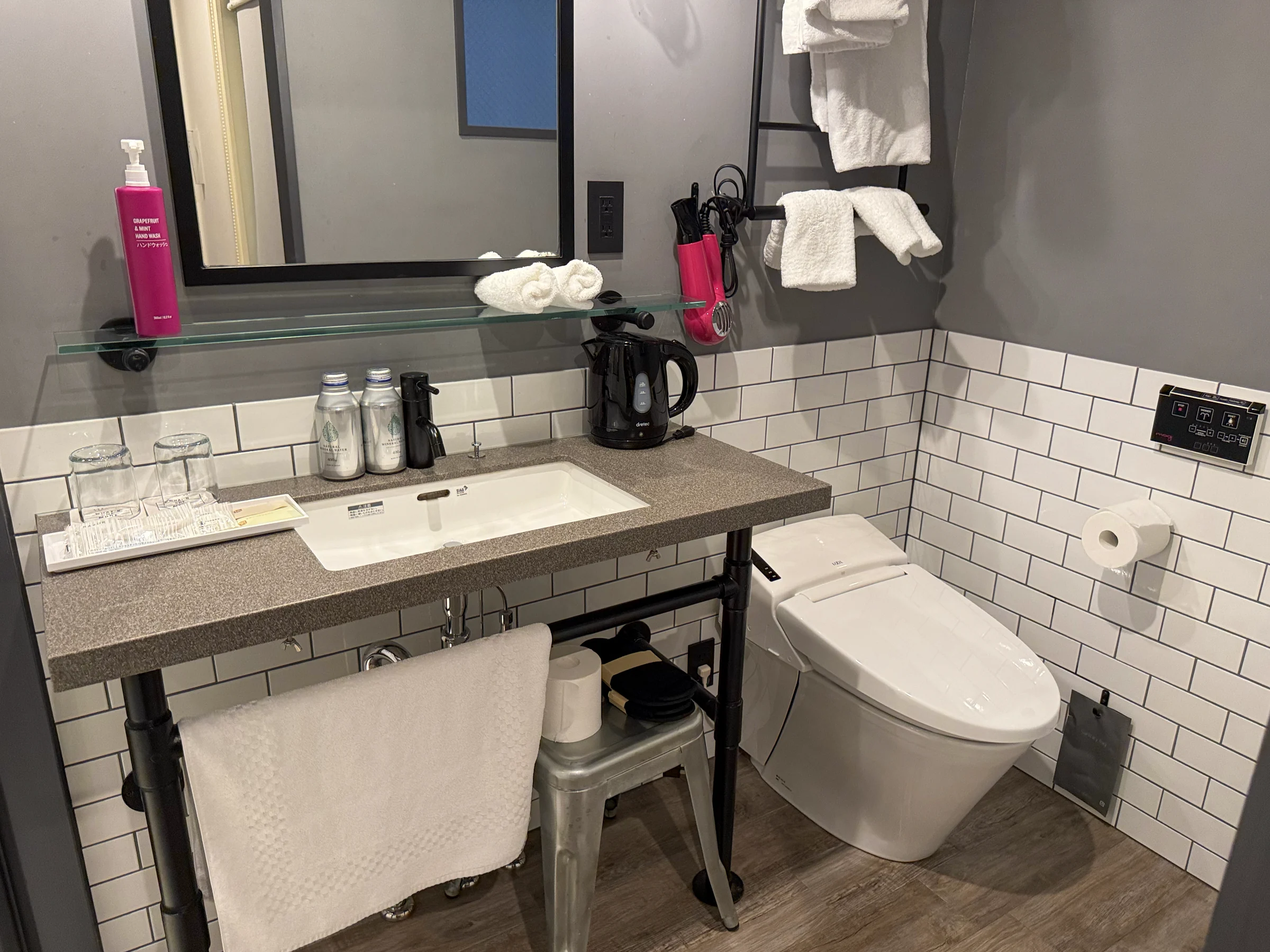 The white-tiled vanity area.