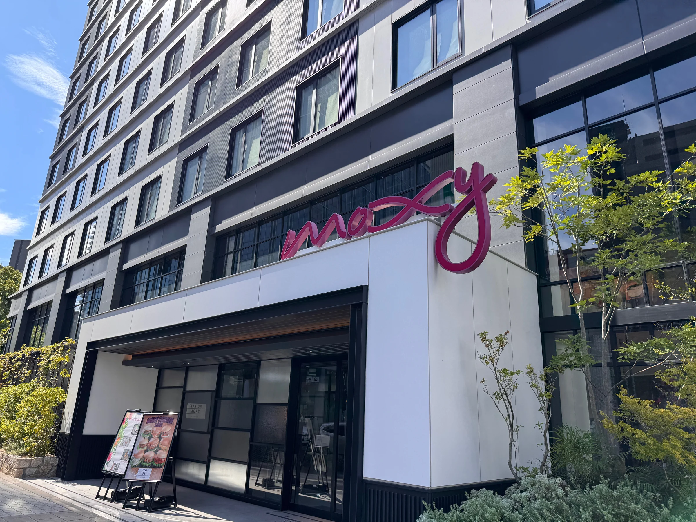 The Moxy logo at the entrance by day