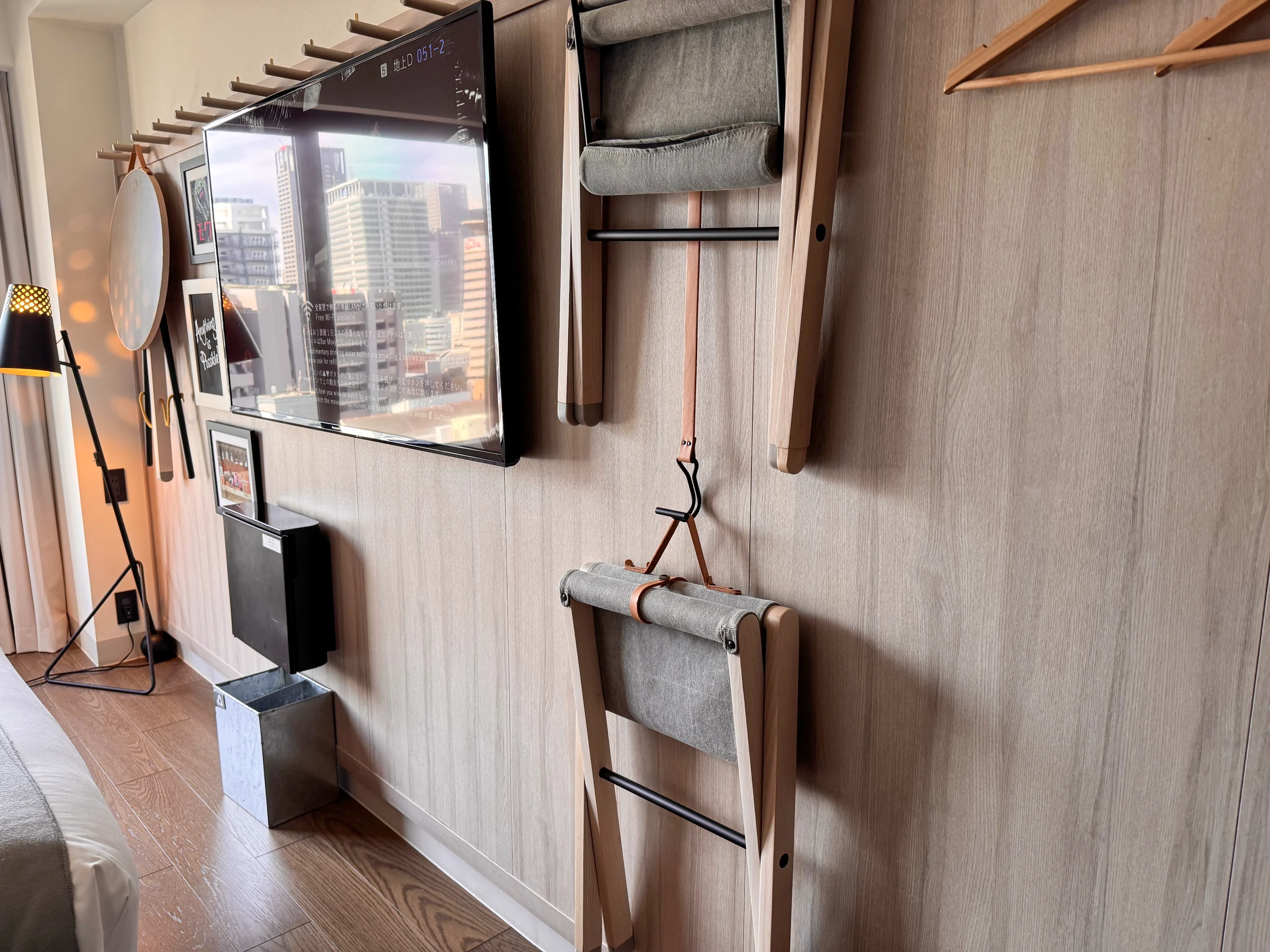 A wall-mounted TV and folding furniture