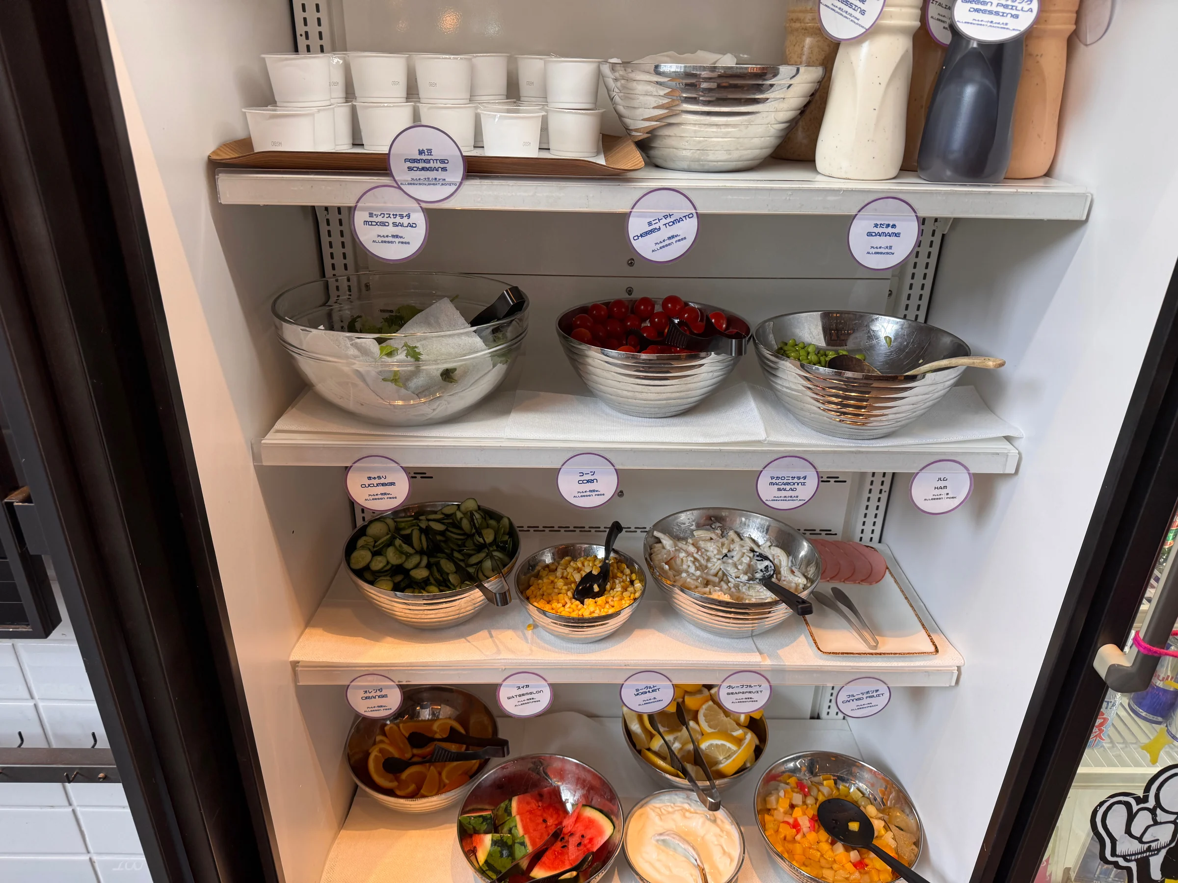 Salad and small dishes in the refrigerated display