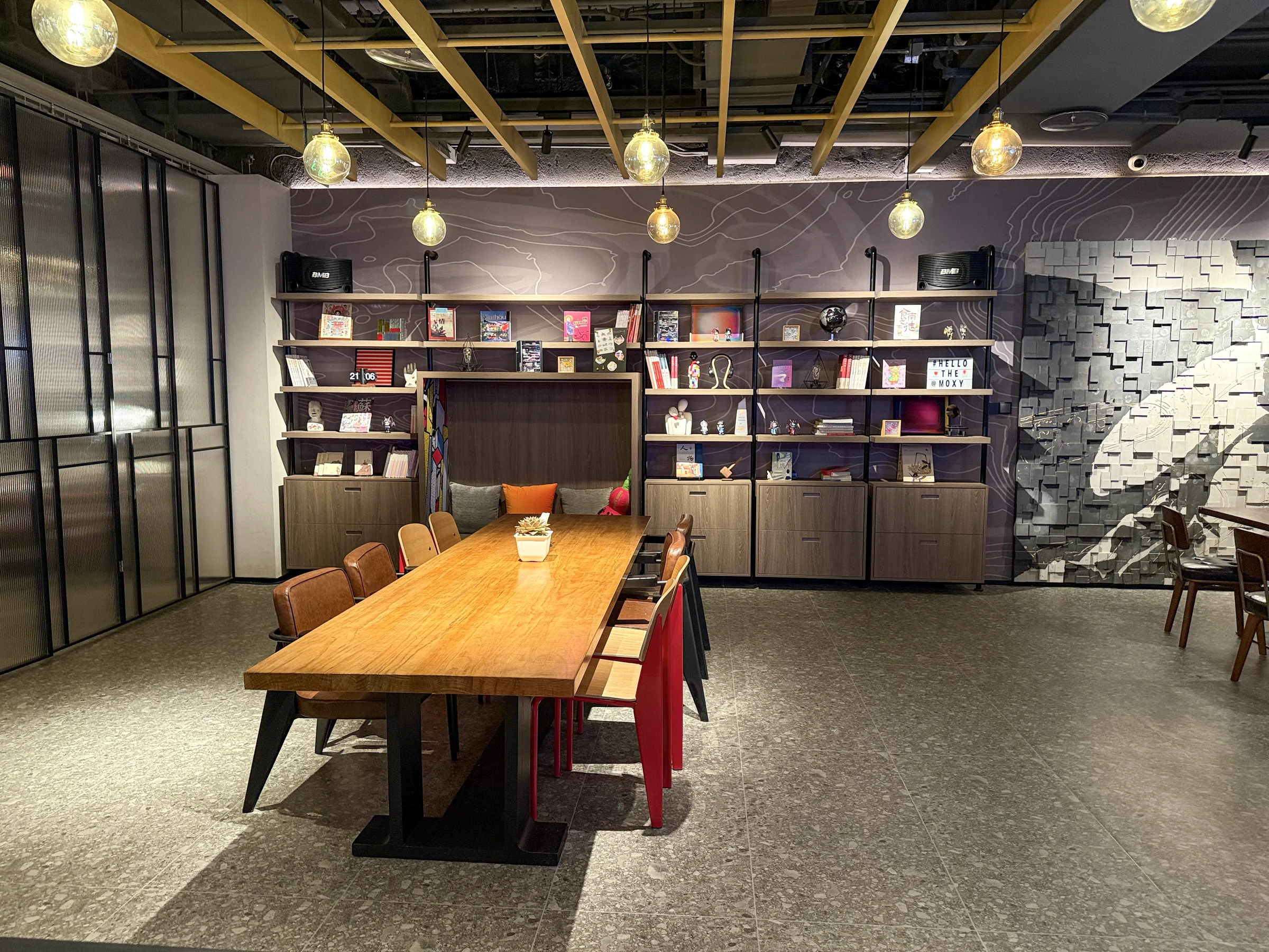 Bookshelves and a large shared table.