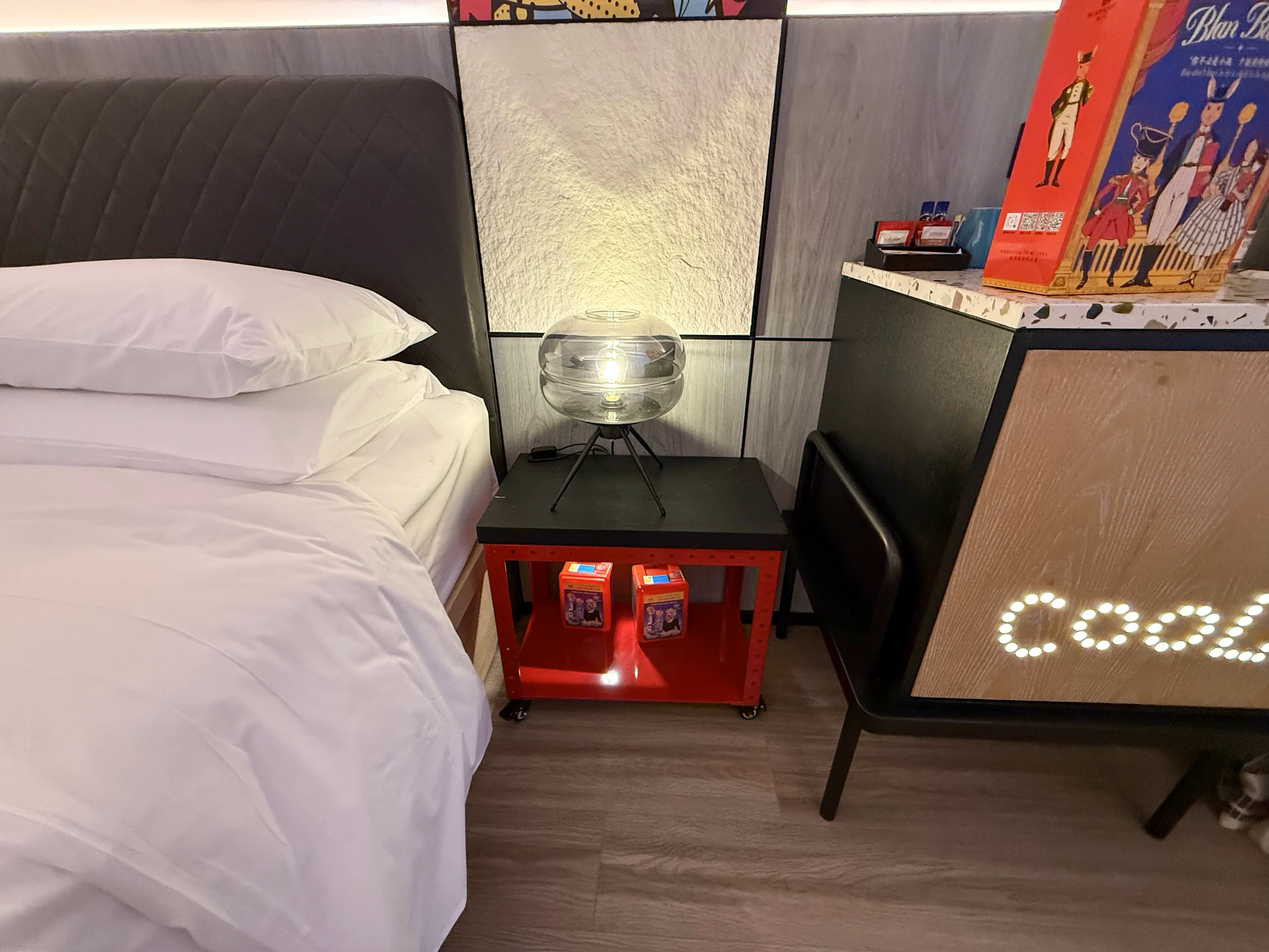 A bedside table with a red frame.