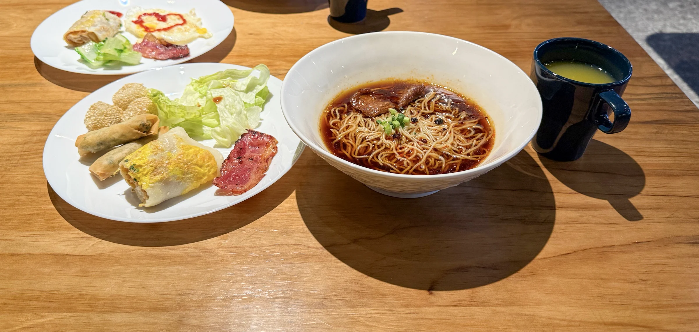 Noodles and spring rolls at breakfast.