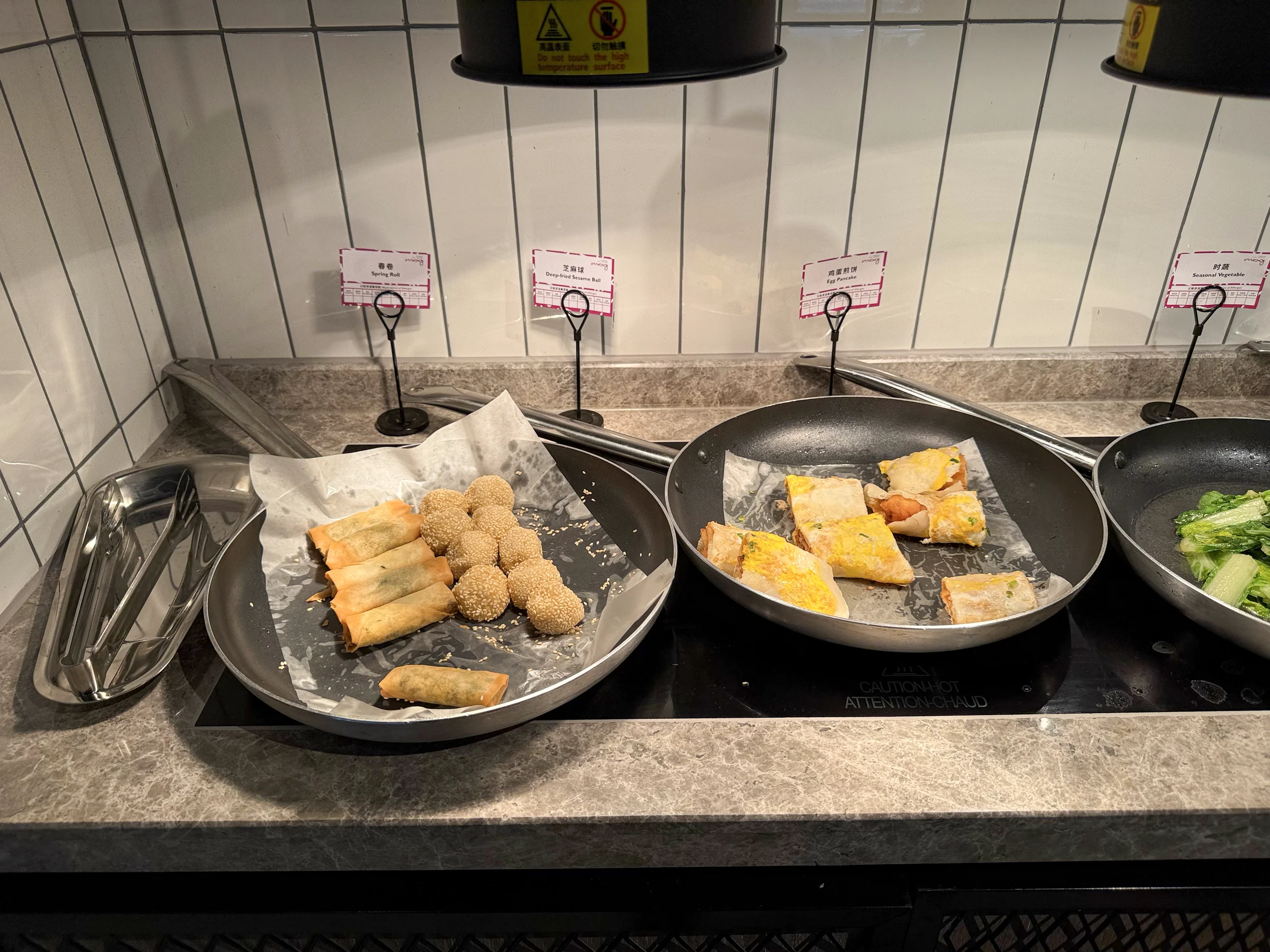 Spring rolls and sesame balls at breakfast.