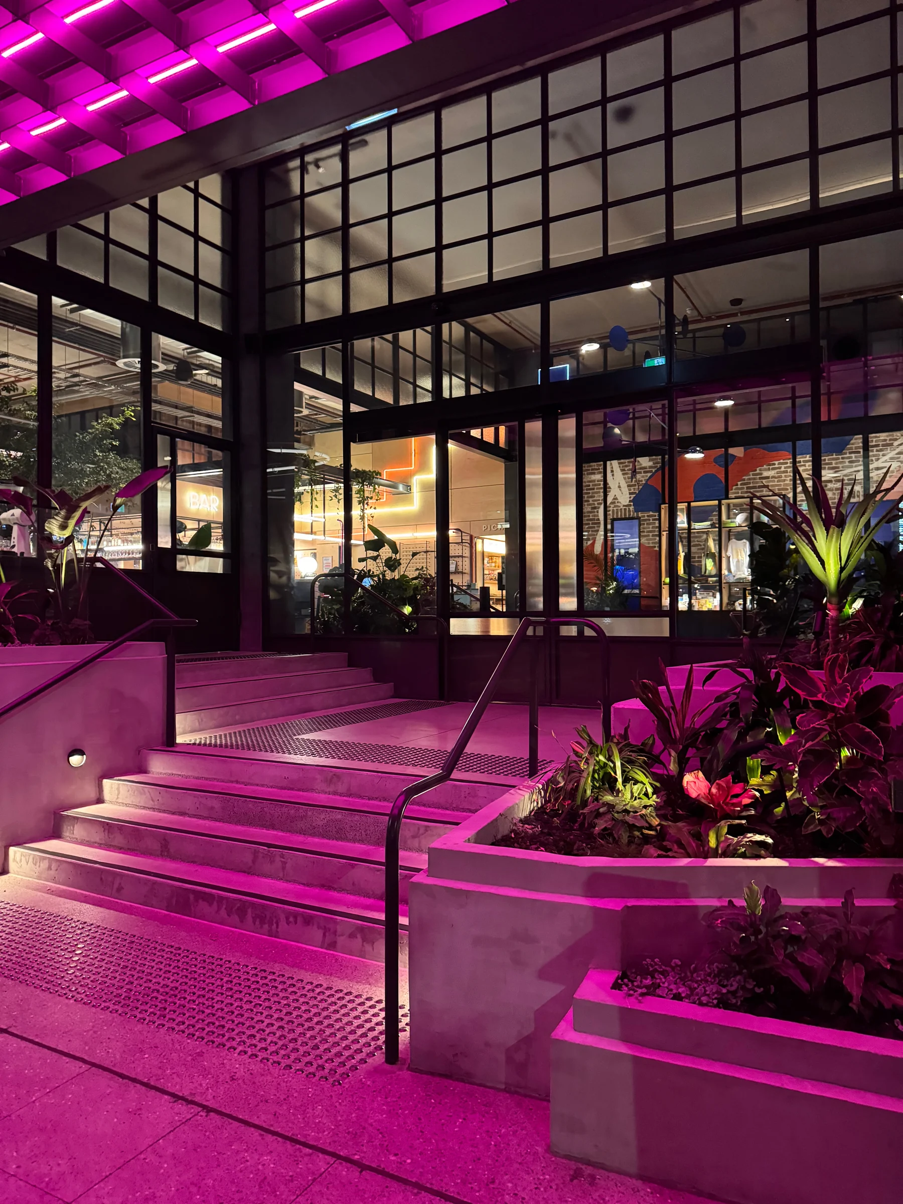 The pink neon entrance to Moxy Sydney Airport (November 2023)