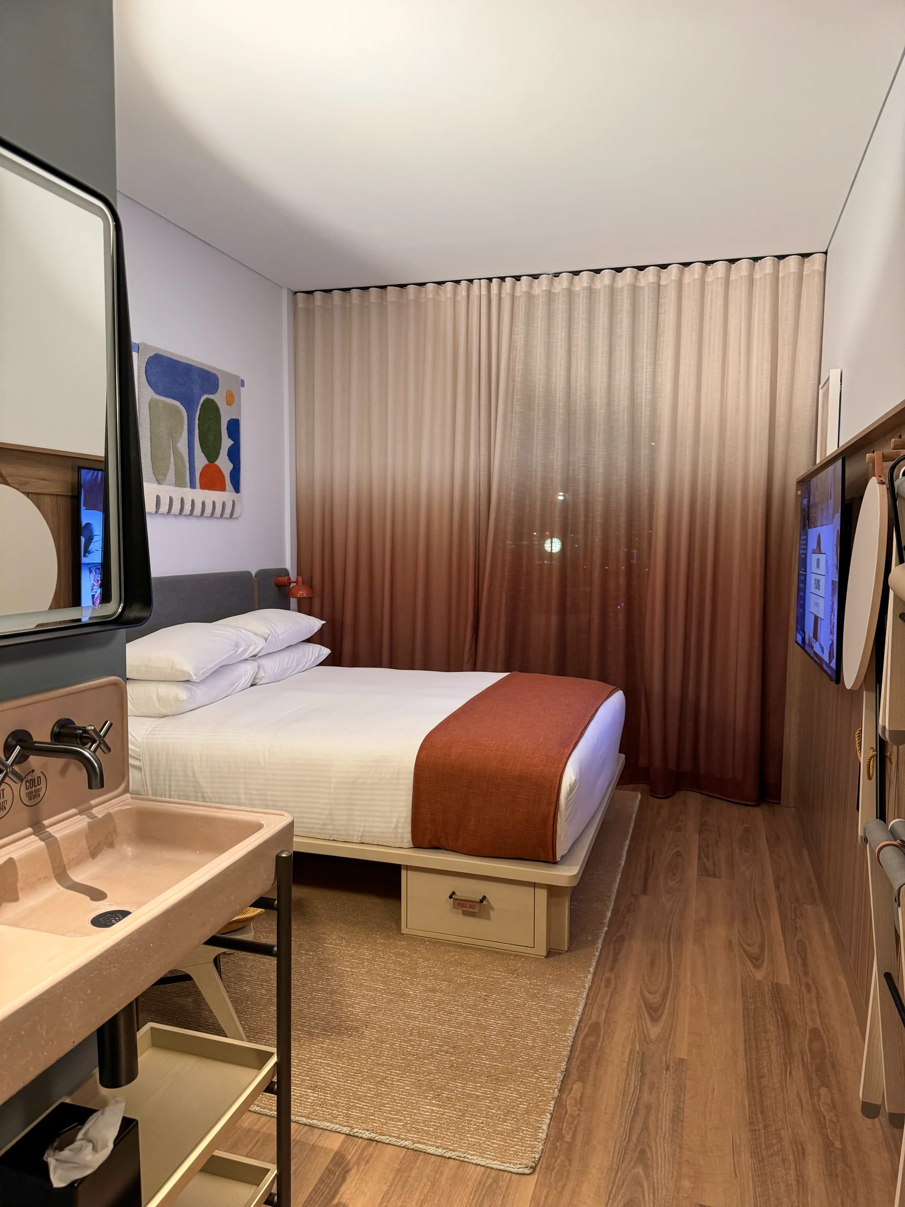Wall-mounted storage beside the bed. | November 2023