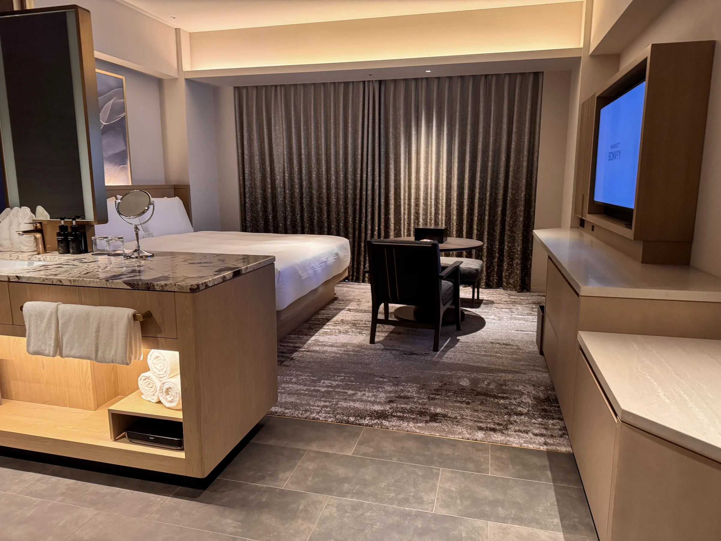Looking from the bathroom through to the bed
