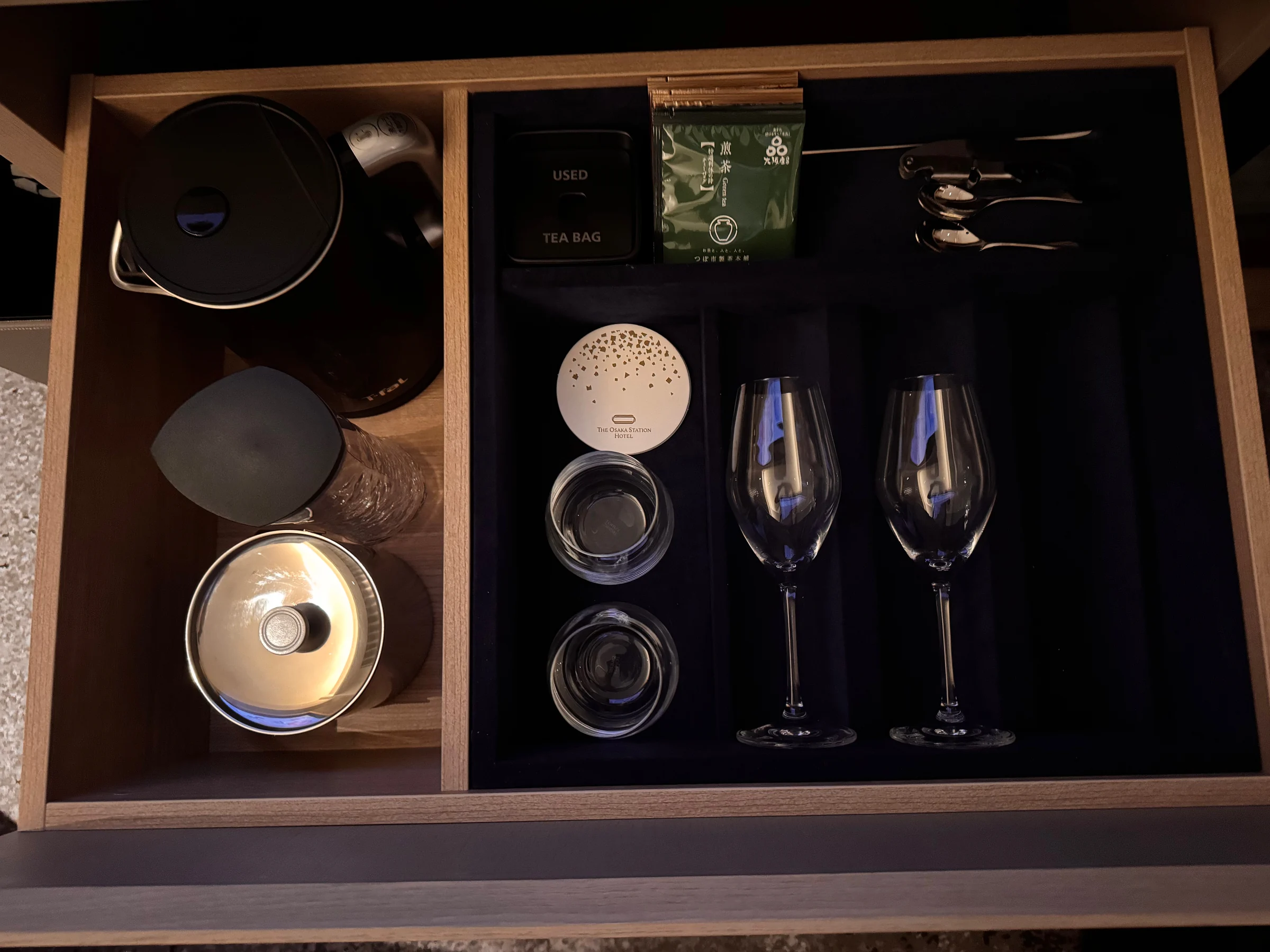 Glasses and tea supplies stored in a drawer