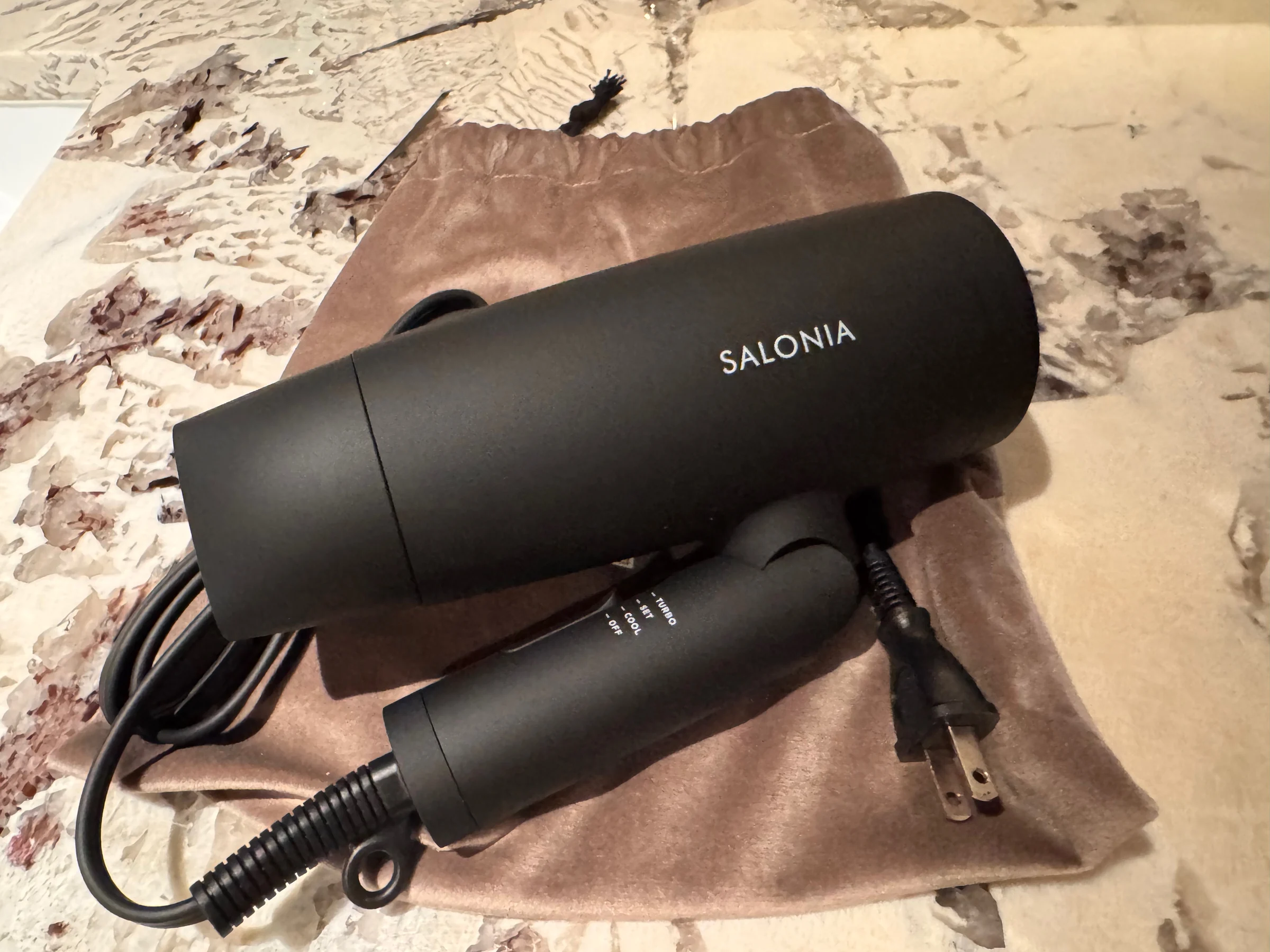 The SALONIA hair dryer provided in the room