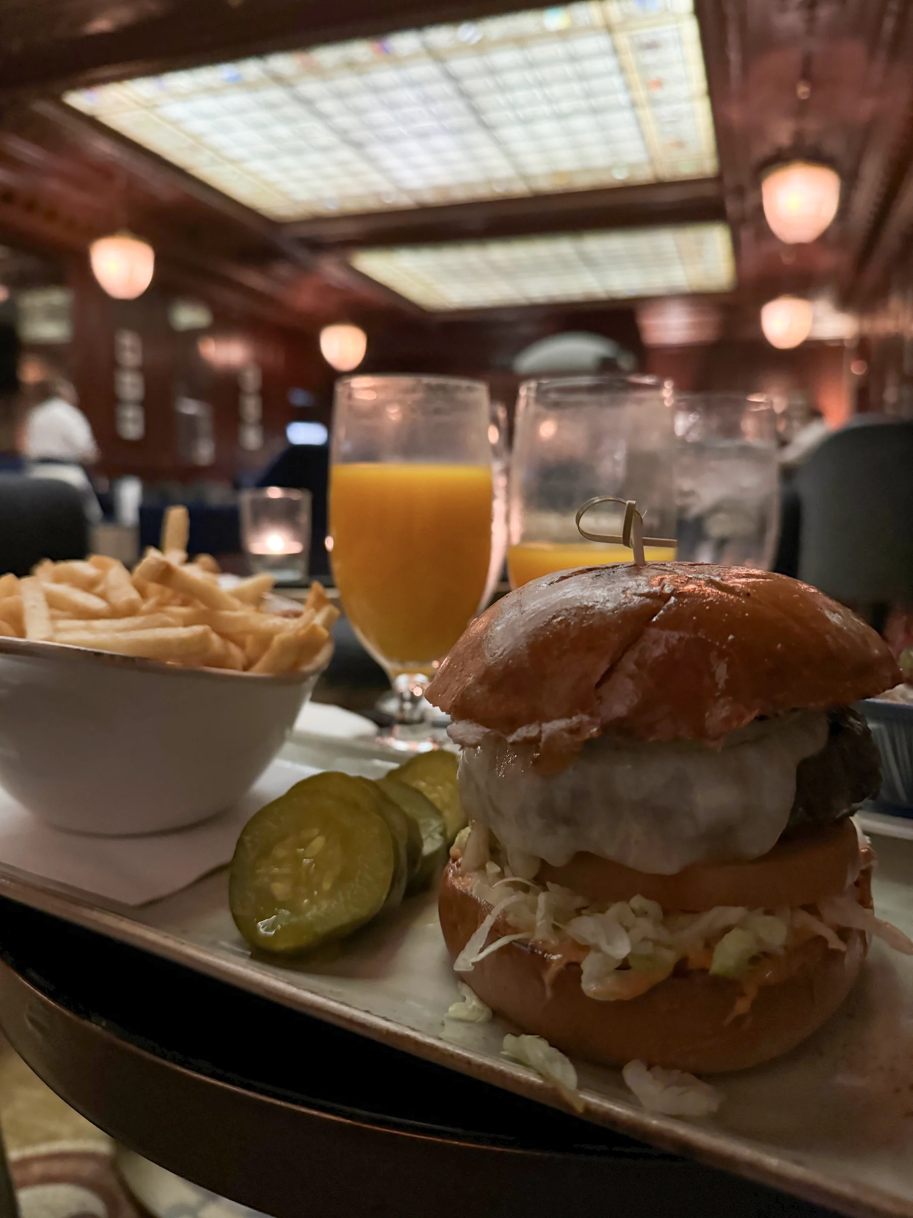 The delicious burger and fries.