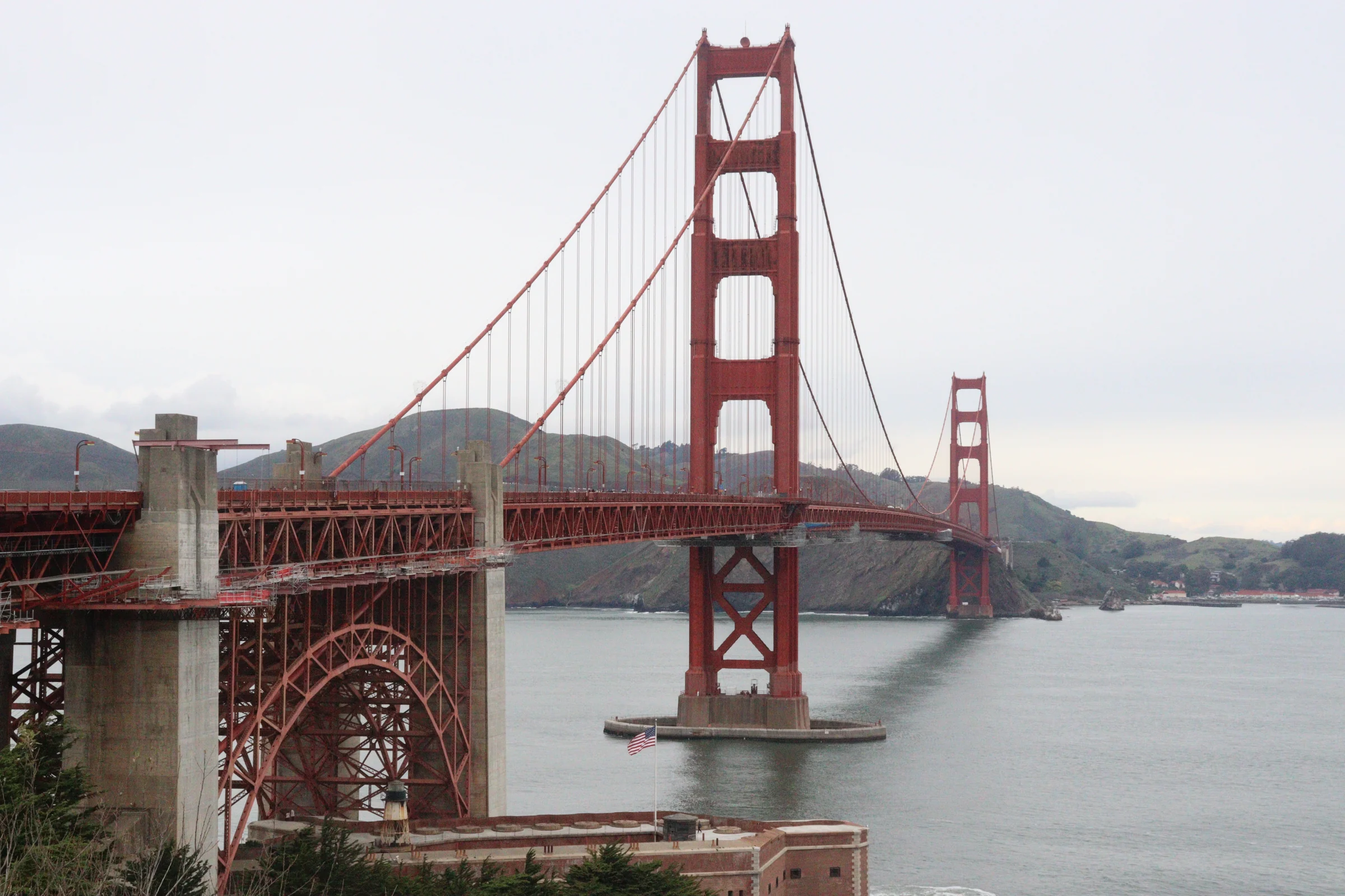 The red bridge stretching across the water.